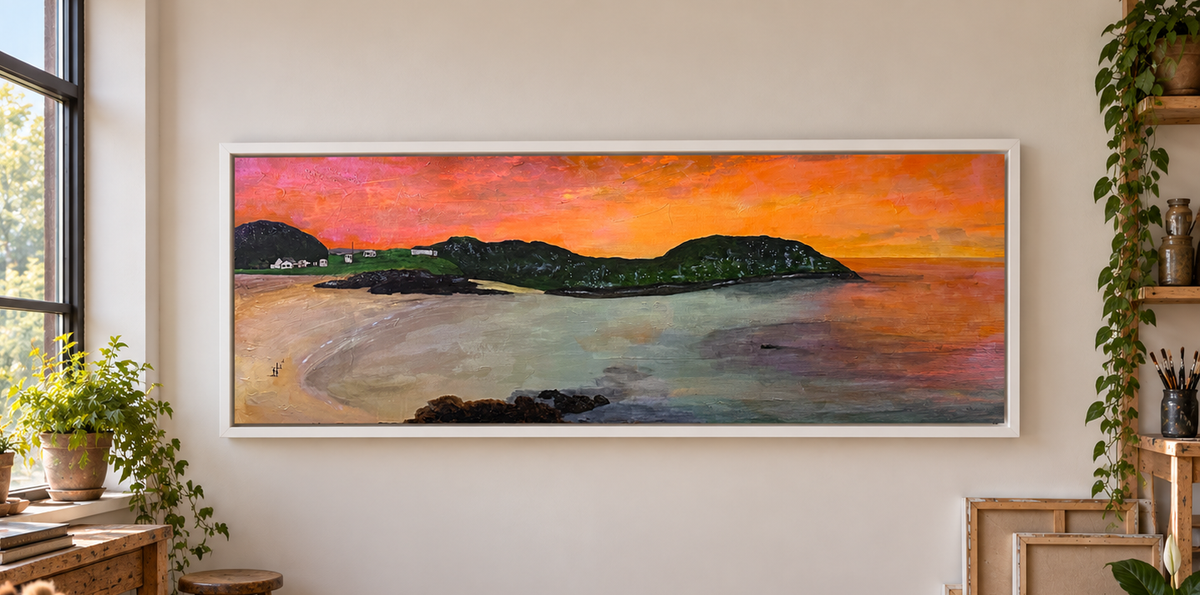 Kevin Hunter's panoramic Achmelvich Beach commission painting at sunset, hanging on a wall between plants