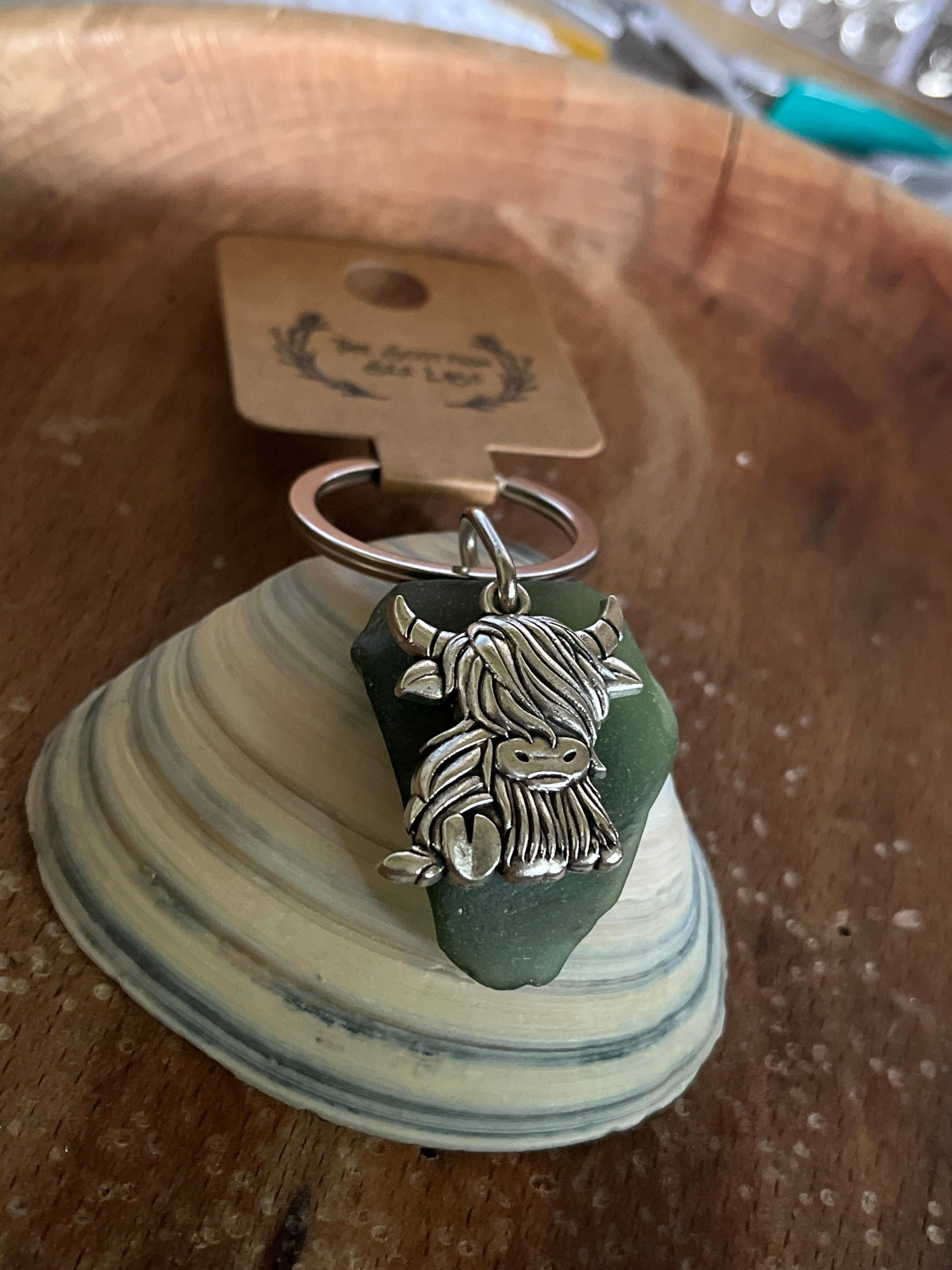 Silver Scottish highland cow charm on seaglass keyring