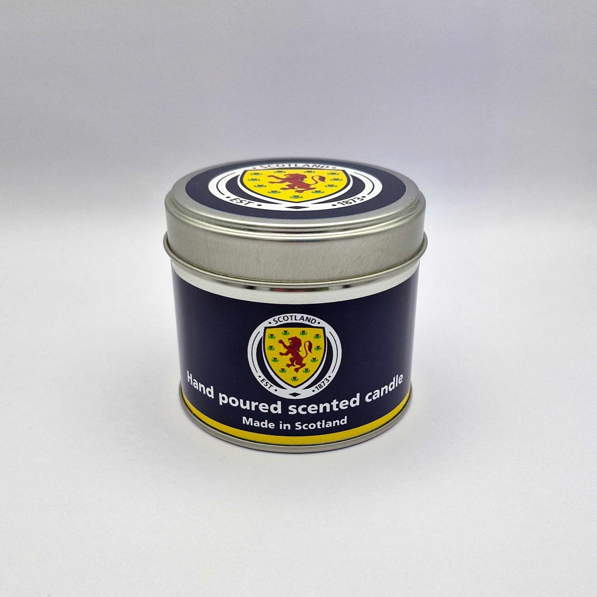 Navy blue and yellow Scottish thistle hand poured scented candle in metallic tin for official Scotland national football team travel
