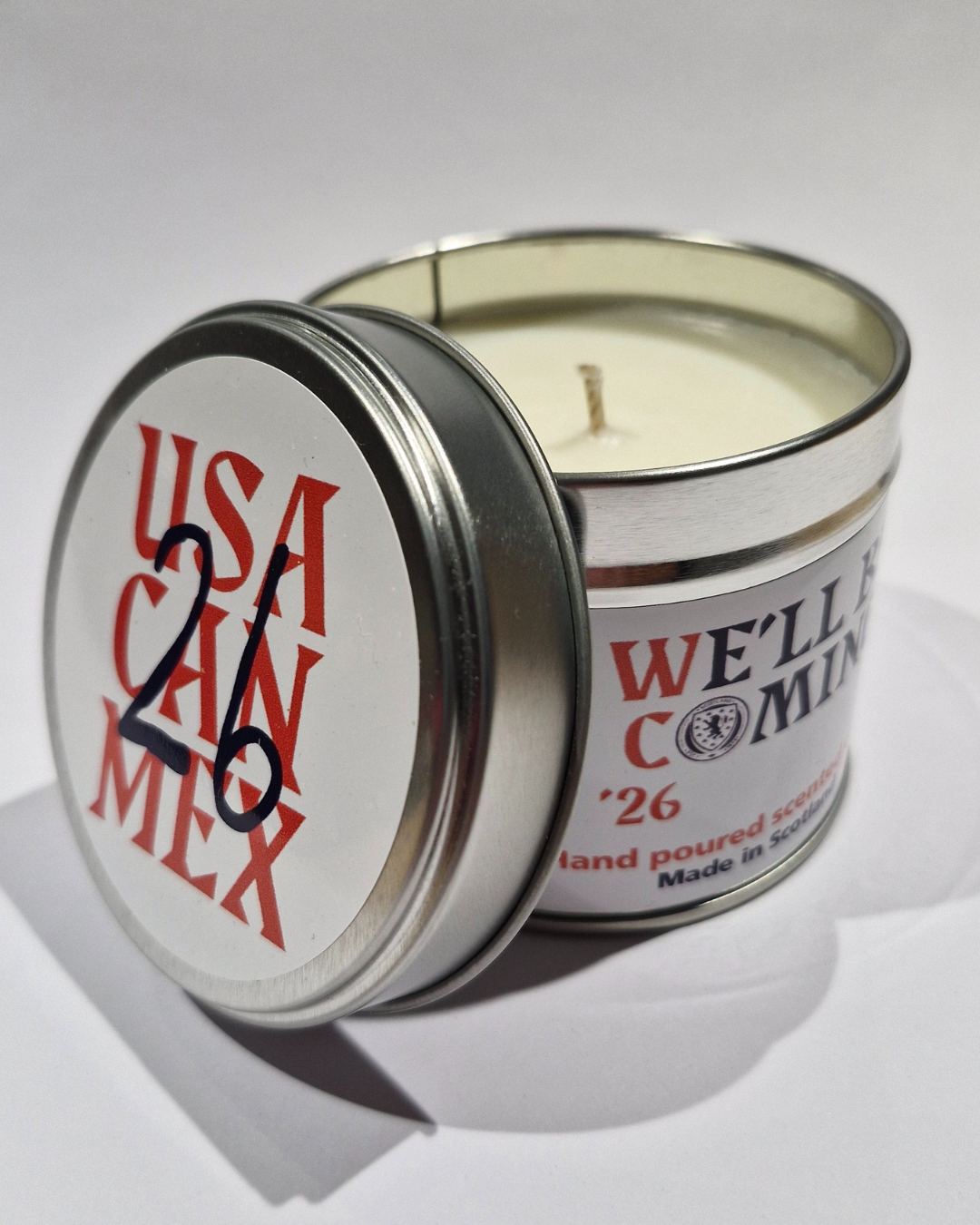 Silver tin candle with white wax and red usa chin mex 26 text and black handwritten style 26 for Scotland football team