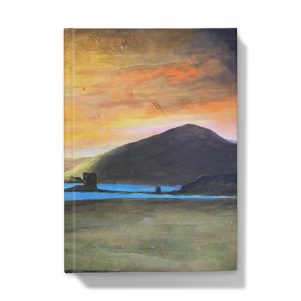Castle Stalker Glow hardback journal with orange-yellow sky landscape cover