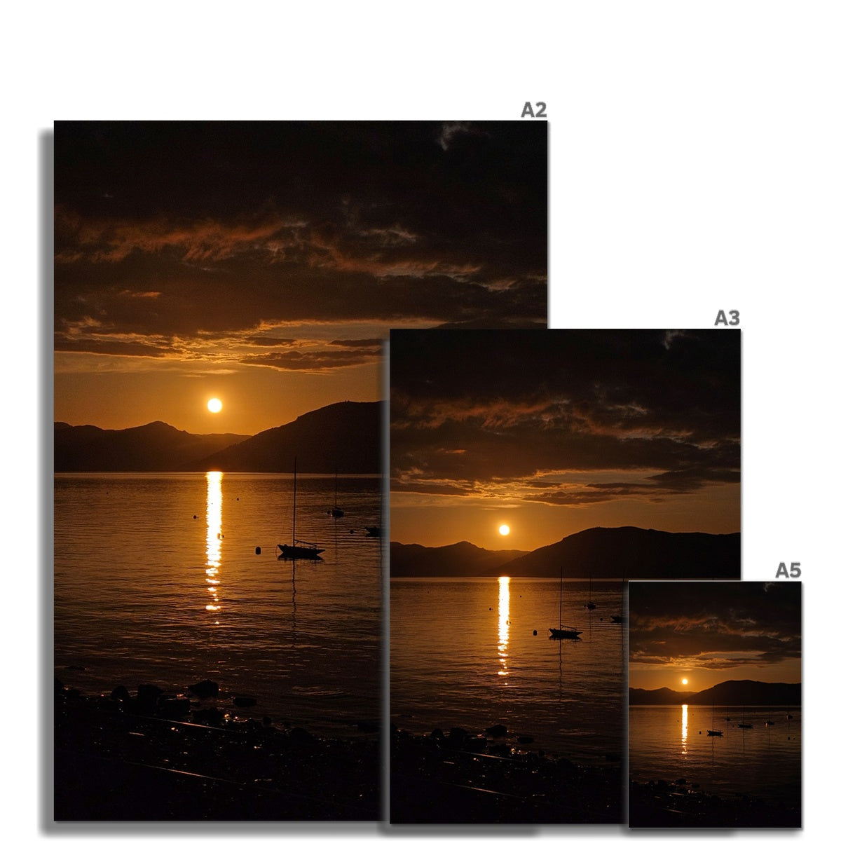 Fine art print of golden sunset over dark mountains and calm water reflecting hills of argyll on the clyde