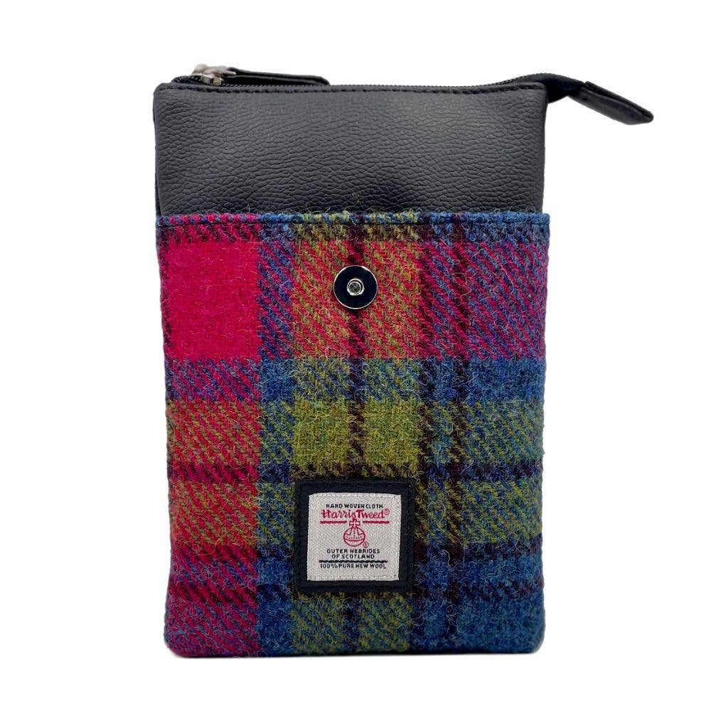 A vibrant multicolored tartan wool Harris Tweed mini crossbody bag with a black leather top and zipper in blue and pink check