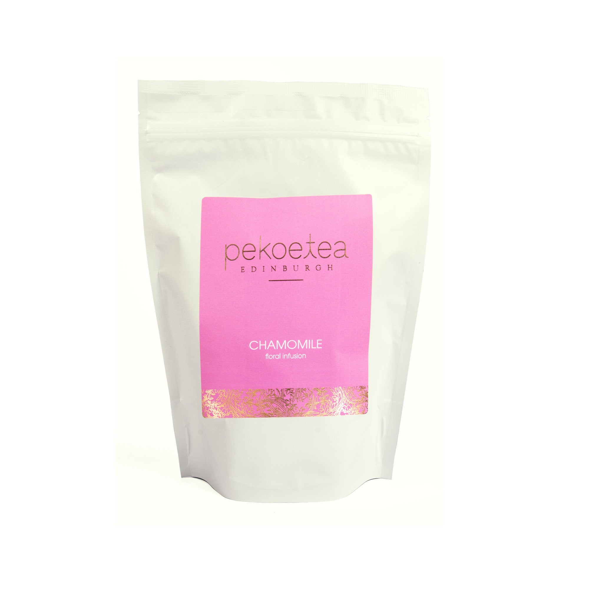 A white resealable pouch of pekoe tea chamomile flowers floral infusion with a vibrant pink label and gold foil detailing