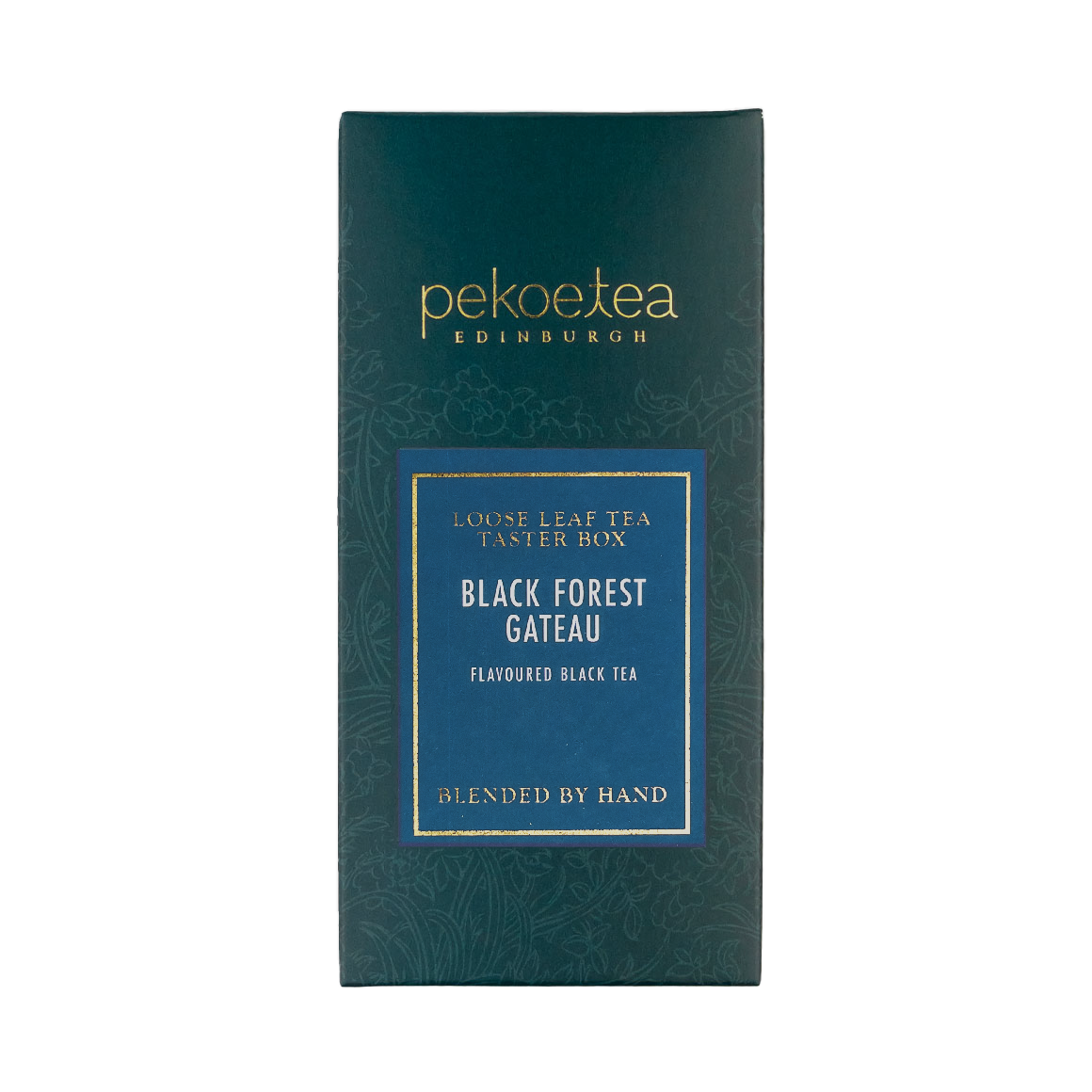 A sleek dark teal rectangular box with gold lettering and blue label for peckoe tea Edinburgh black forest gateau black tea