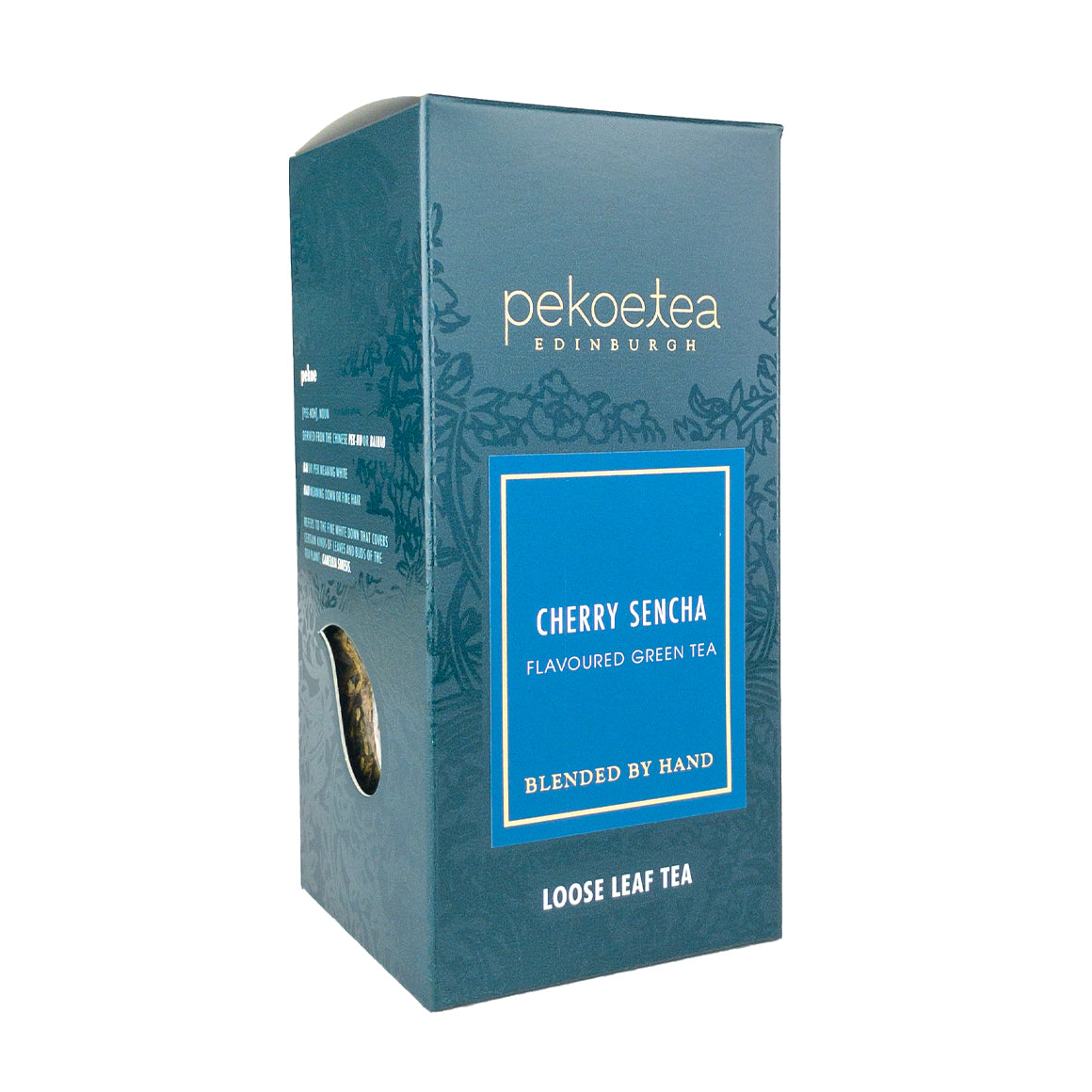 Tea box with deep teal exterior and blue label featuring pekoé tea edinburgh cherry sencha flavoured green tea