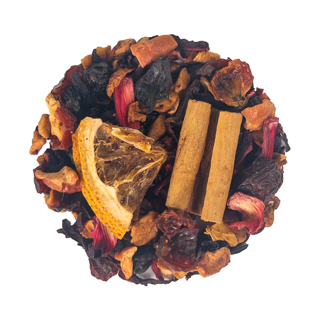 A vibrant mix of dried fruits spices and citrus slice arranged in a circle for mulled wine preparation