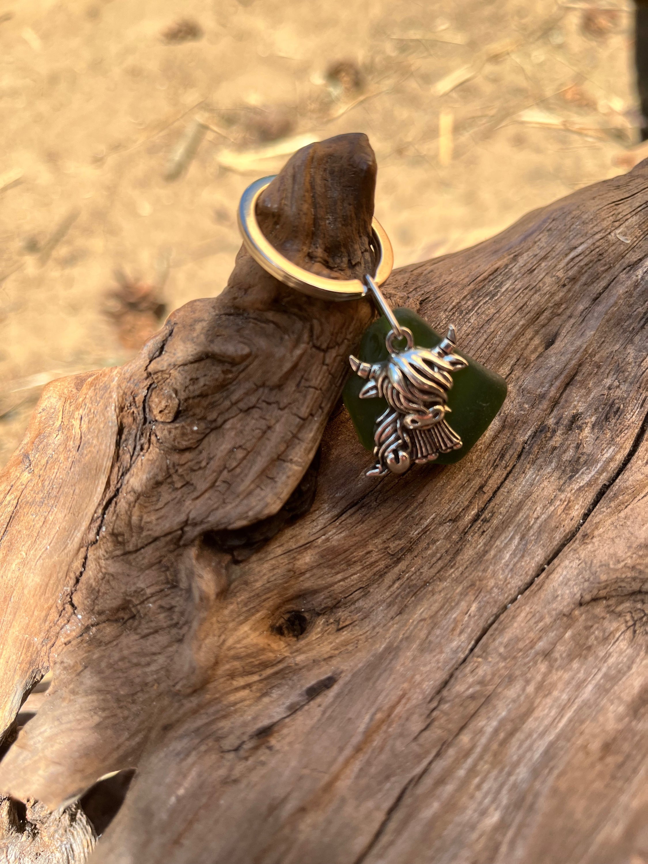 Scottish highland cow seaglass keyring with silver cow charm on green glass