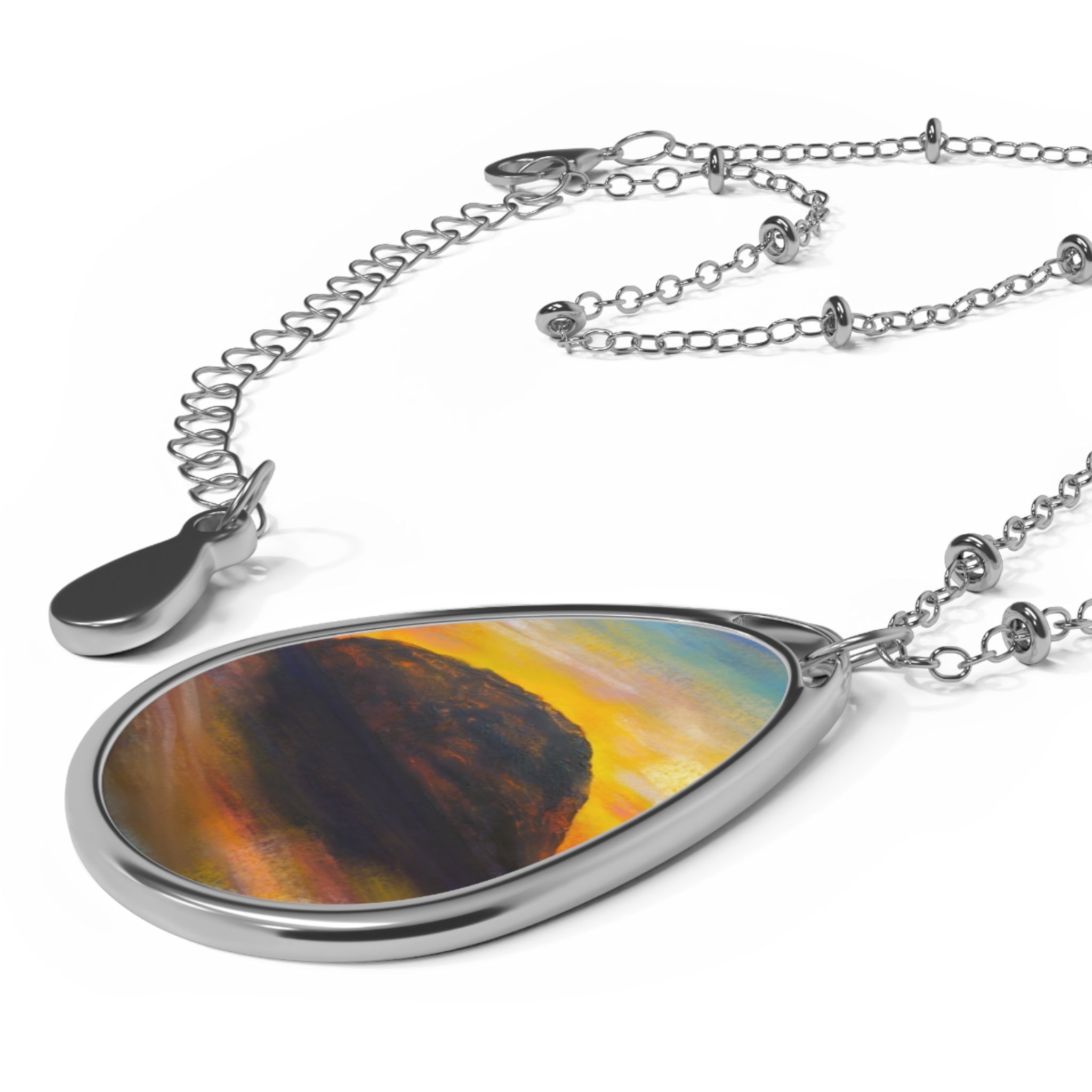 Silver-toned teardrop pendant necklace with colorful abstract design from Ailsa Craig Dusk Scottish Jewellery