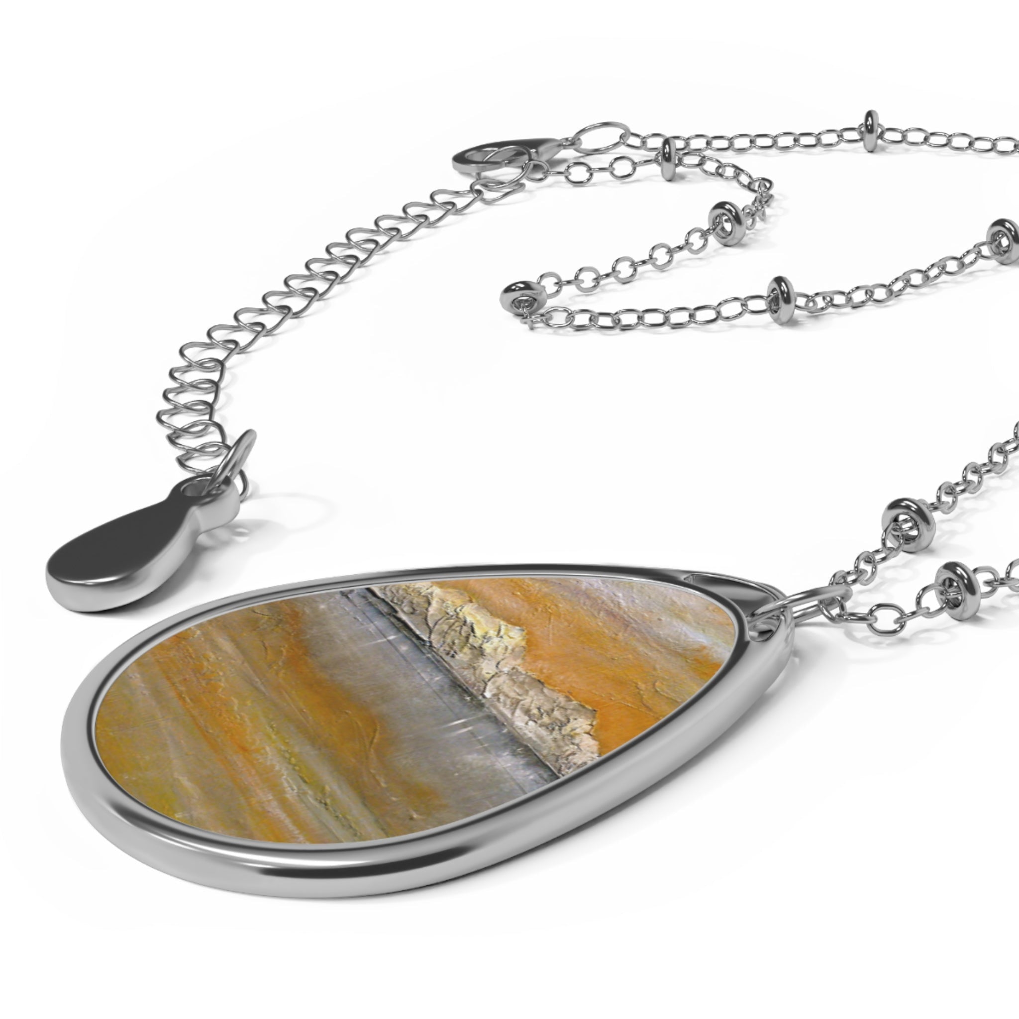 Arran Snow silver teardrop pendant necklace with orange gray stone