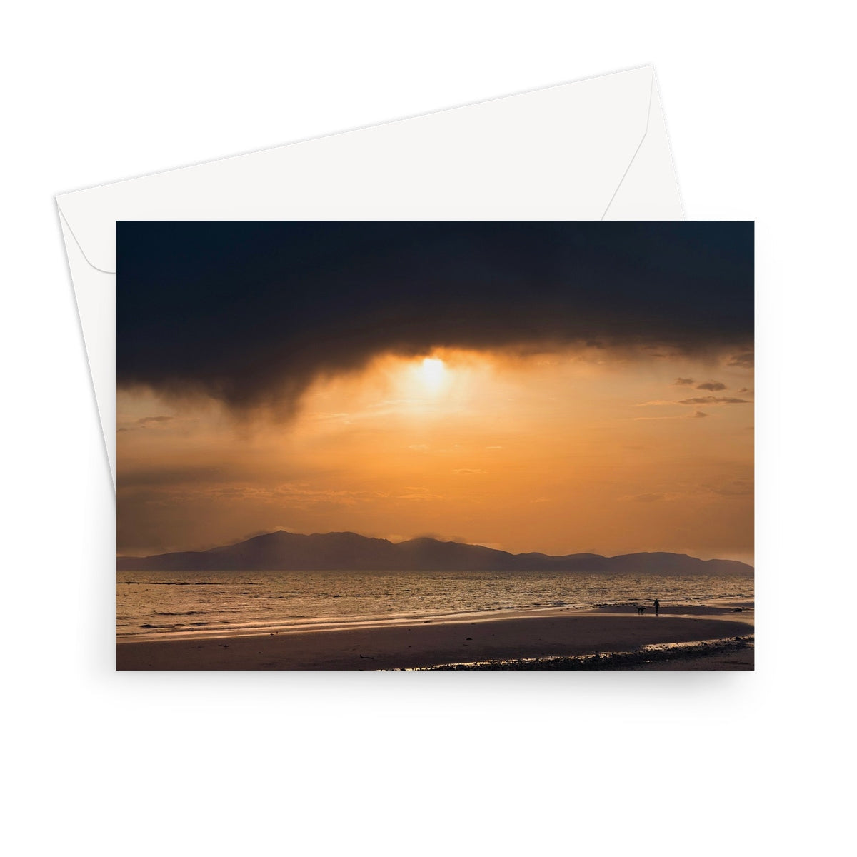 Arran Stormy Sunset greeting card: beach scene with sunset, storm clouds, person walking on sand