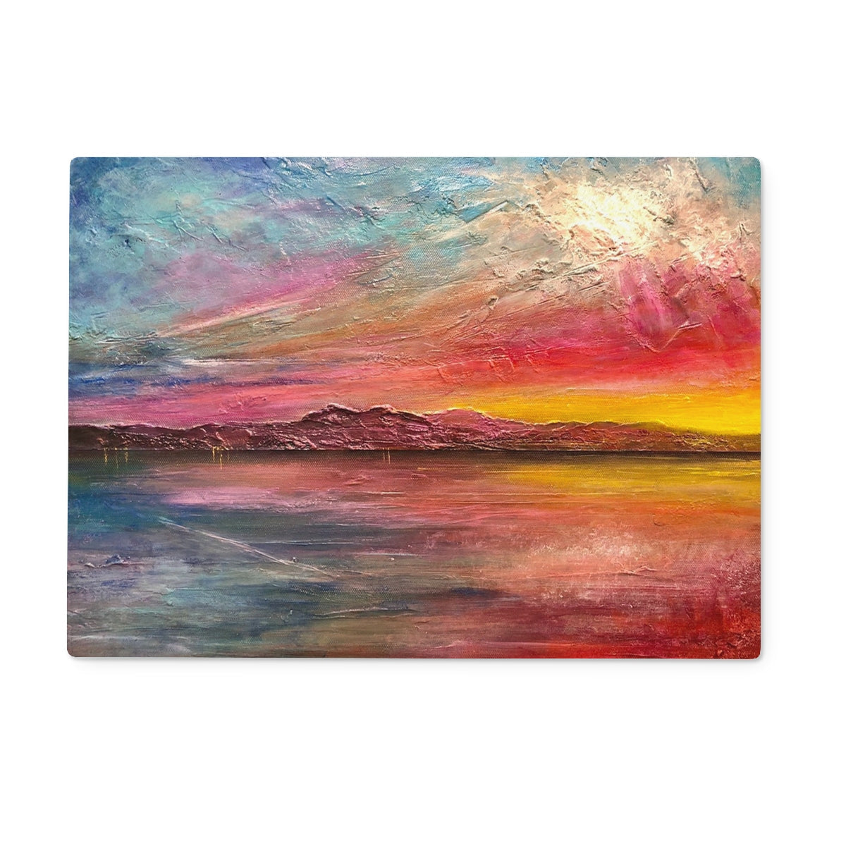Vibrant sunset over water on Arran Sunset II glass chopping board