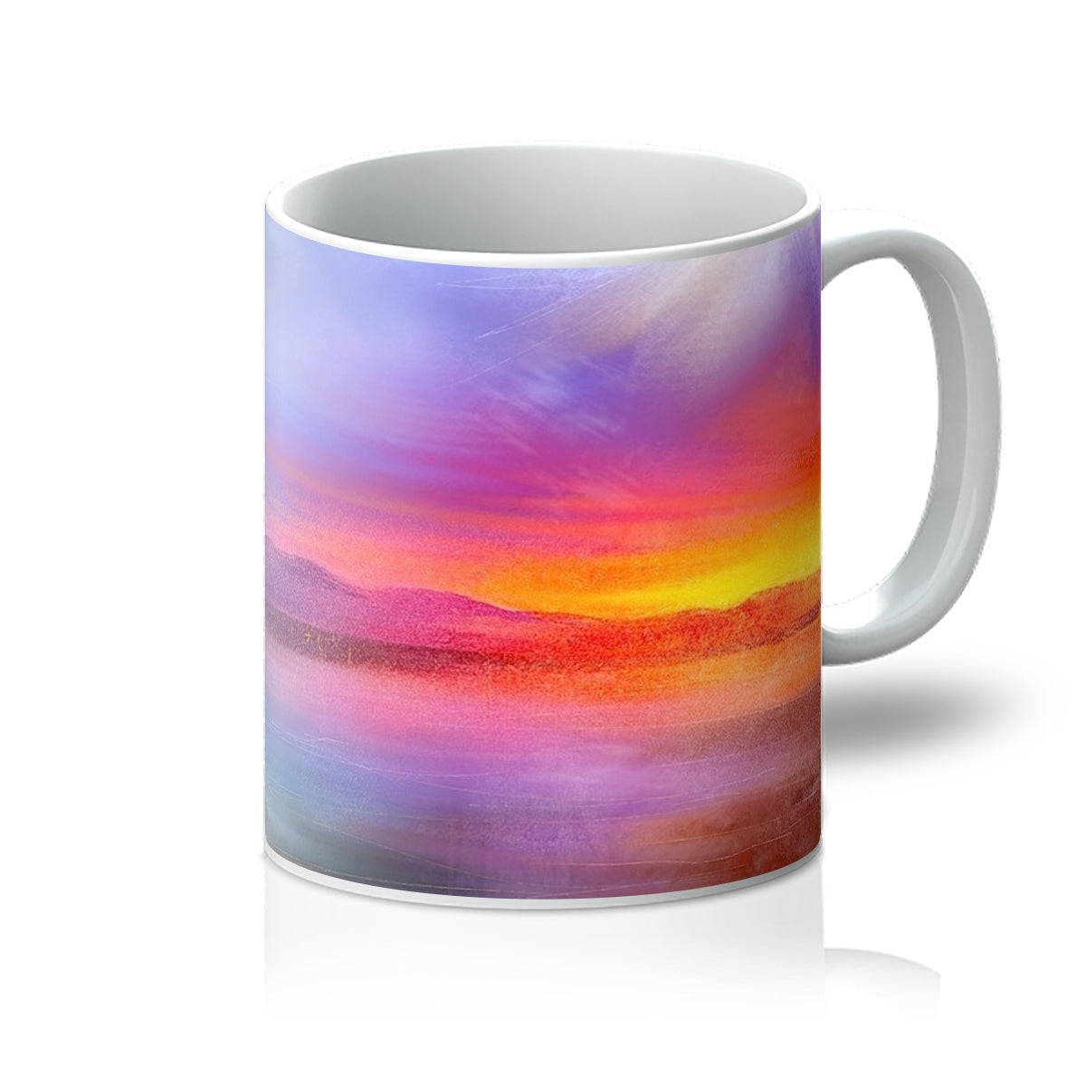 White ceramic Arran Sunset Mug featuring a vibrant sunset landscape design
