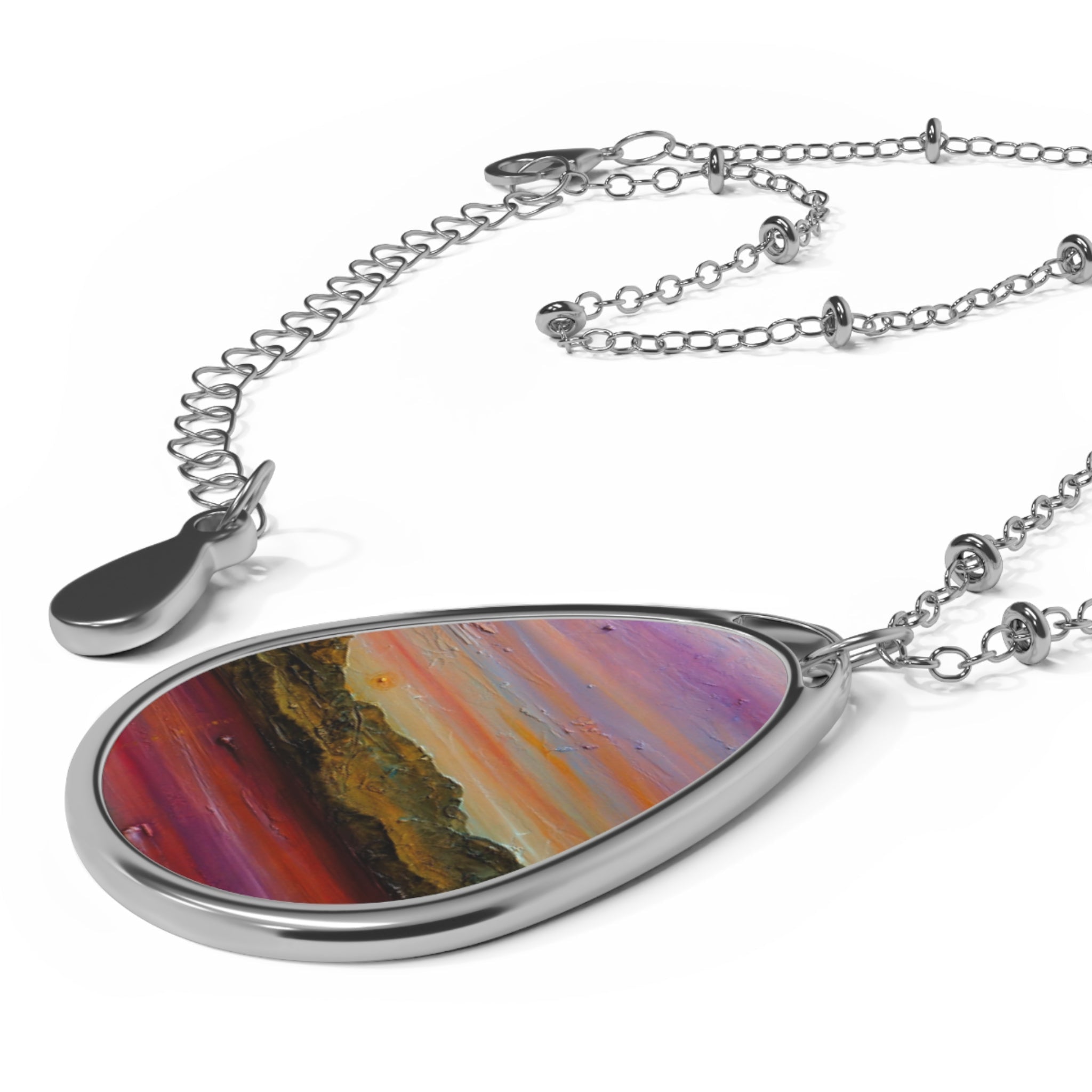 Arran Winter Dusk silver teardrop pendant with abstract purple orange red art