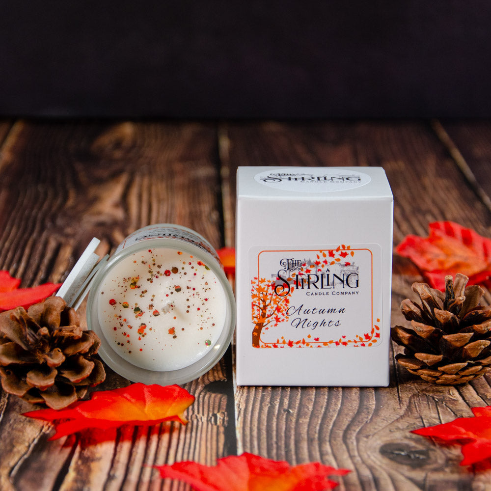Autumn Nights small white scented candle with colorful sprinkles in clear jar by String Candle Company