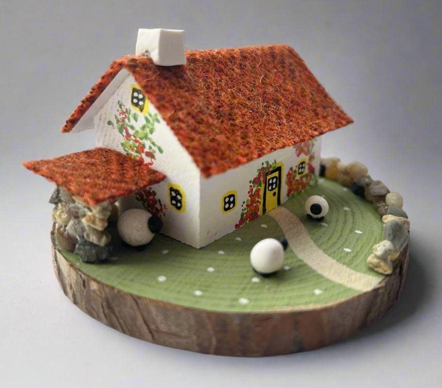 Miniature Scottish Bothy with red roof floral details, decorative sheep on wooden base