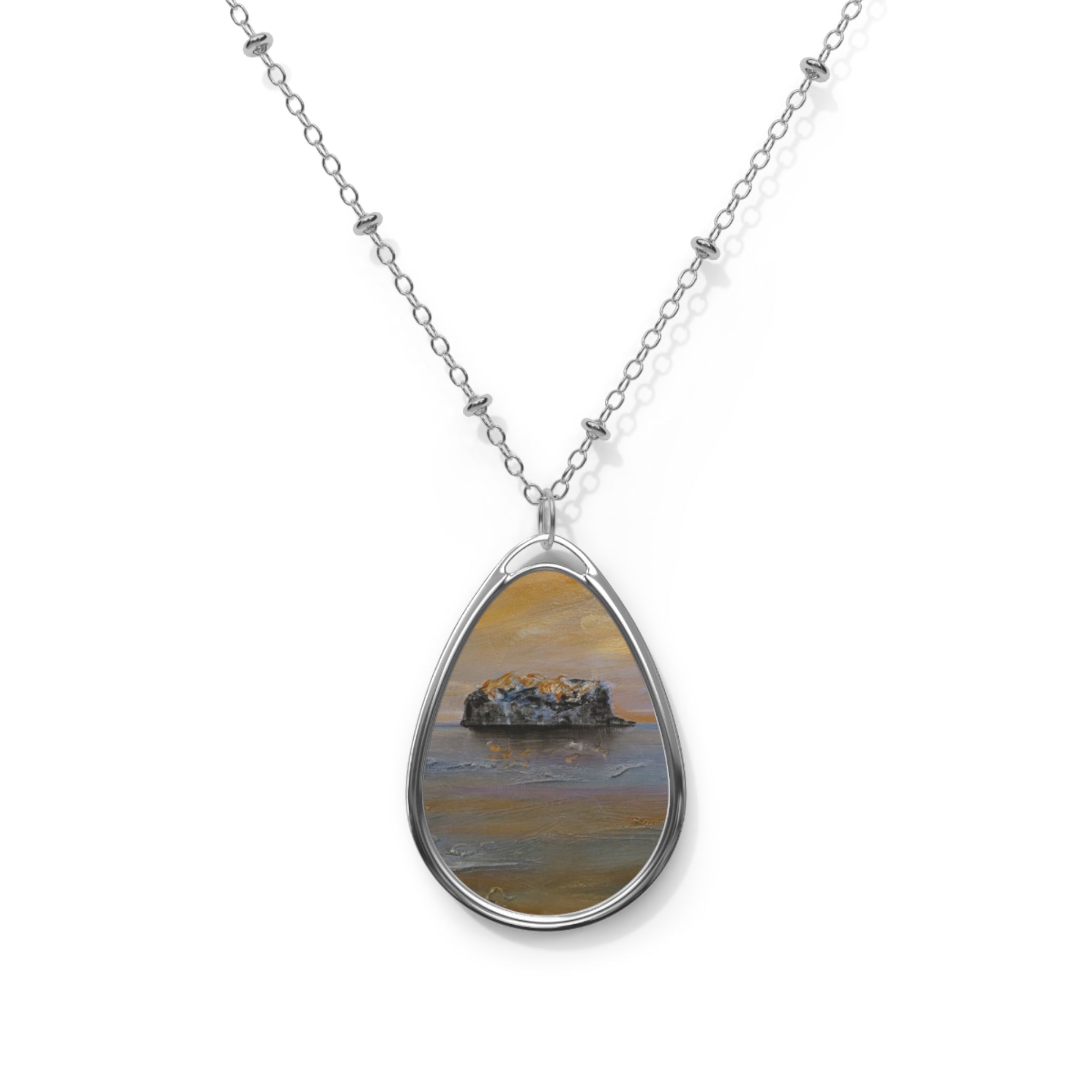 Silver-toned teardrop pendant with miniature Scottish landscape painting on a delicate chain
