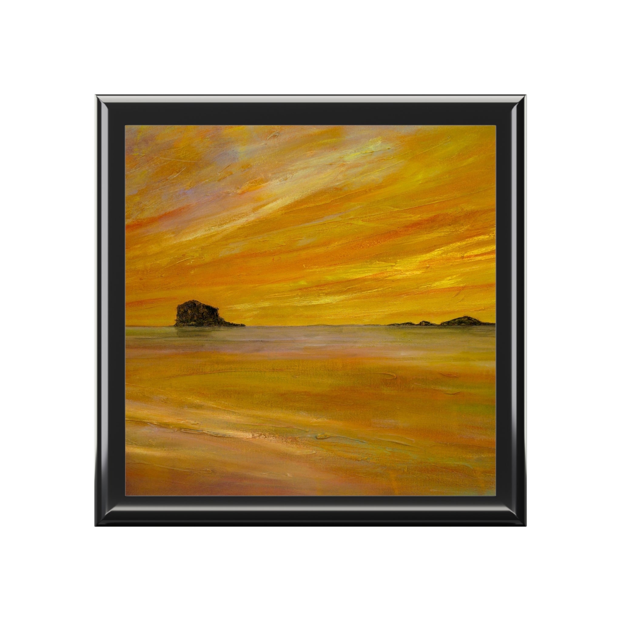 Serene sunset over Bass Rock in Scotland, orange hues in square frame
