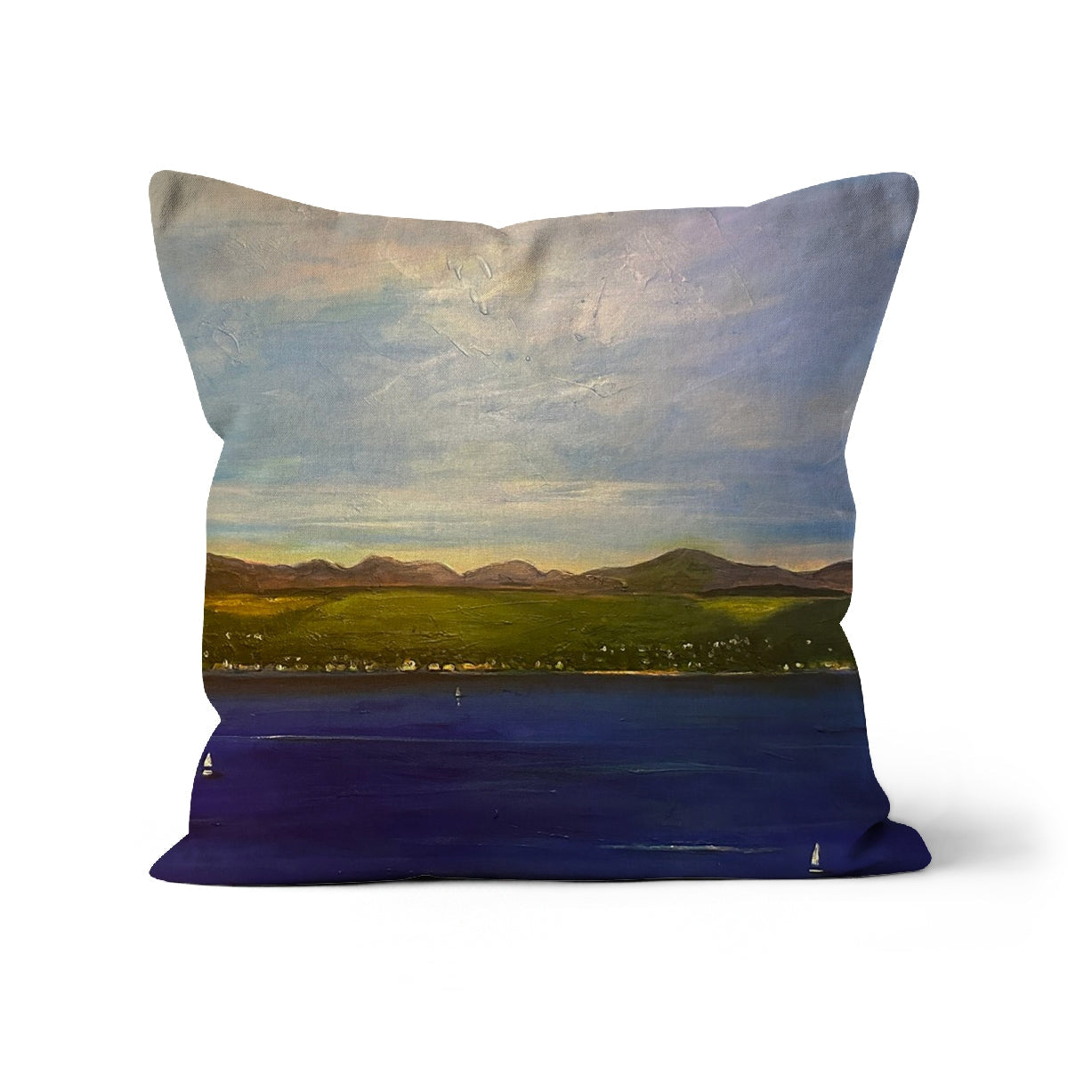 Decorative throw pillow The Biggie Cushion featuring a landscape painting of a coastal town, mountains, and sailboats