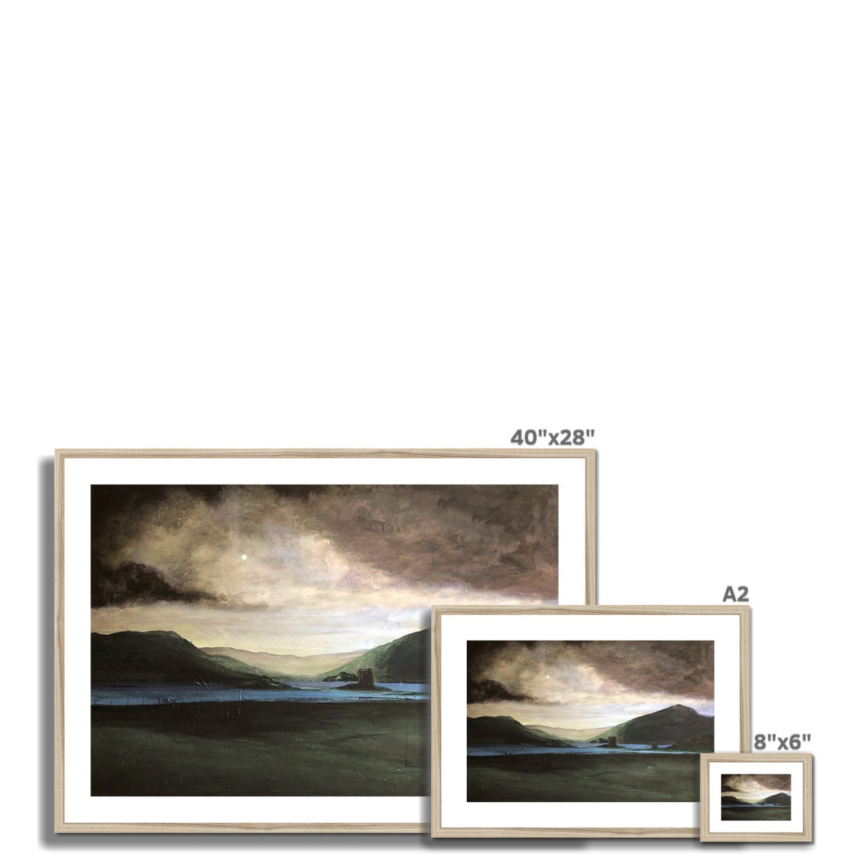Three framed landscape prints of varying sizes displayed with the Brooding Castle Stalker print