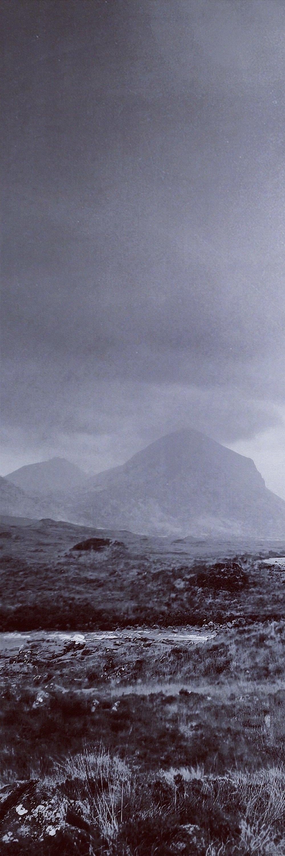 Desolate rocky landscape under cloudy sky in Brooding Cuillin Skye Triptych wall art