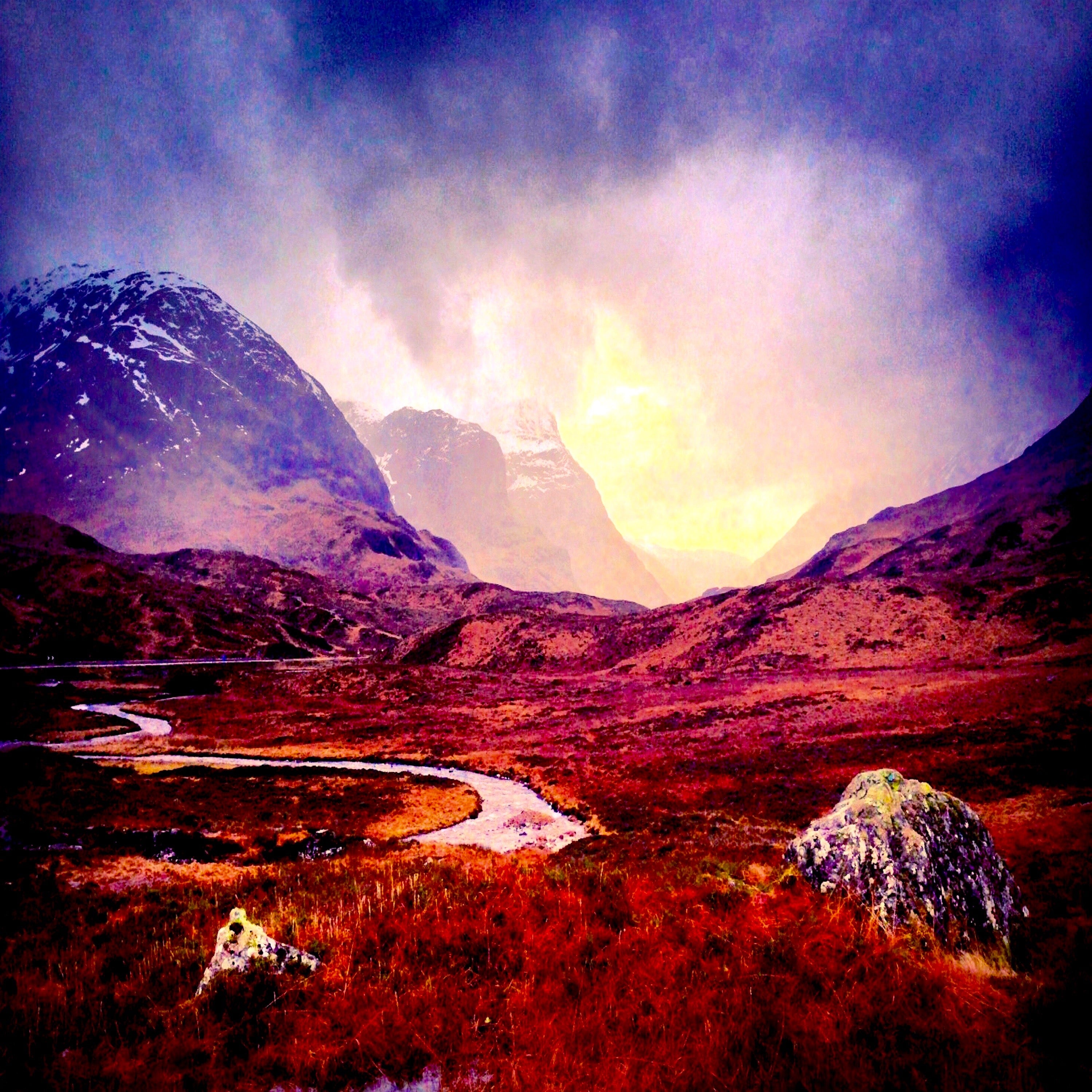 A Brooding Glencoe Scotland In Your Pocket vibrant snowy mountains winding river glowing sky