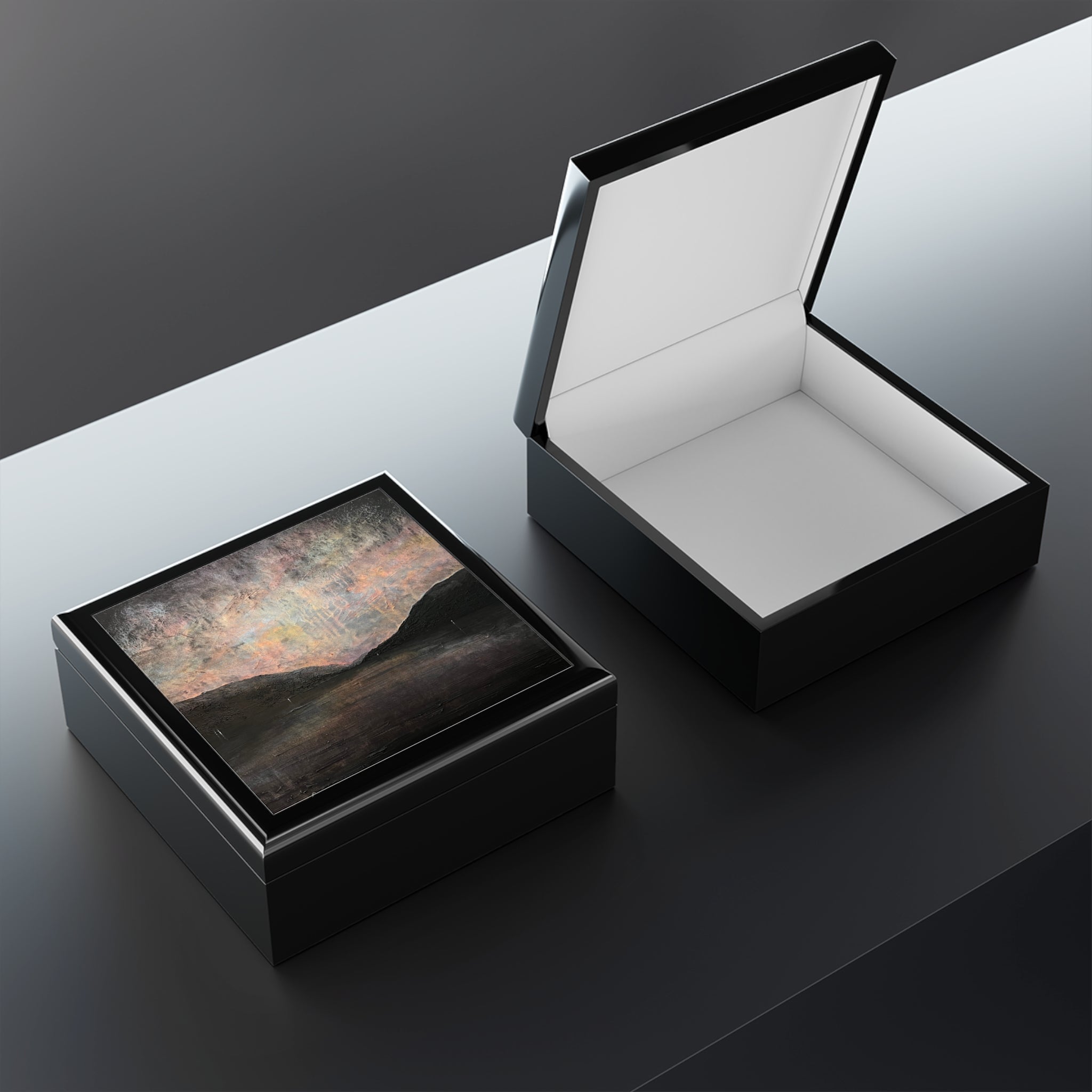 Open black lacquered Loch Lomond jewellery box with mountain lid and white interior