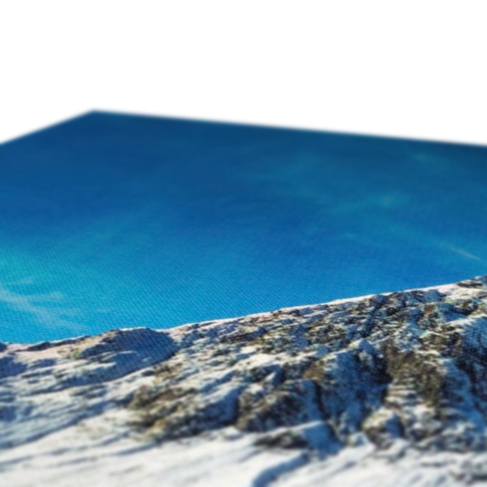 Blue water pool cover with textured surface and white border on Buachaille Etive Mor Winter Canvas Print