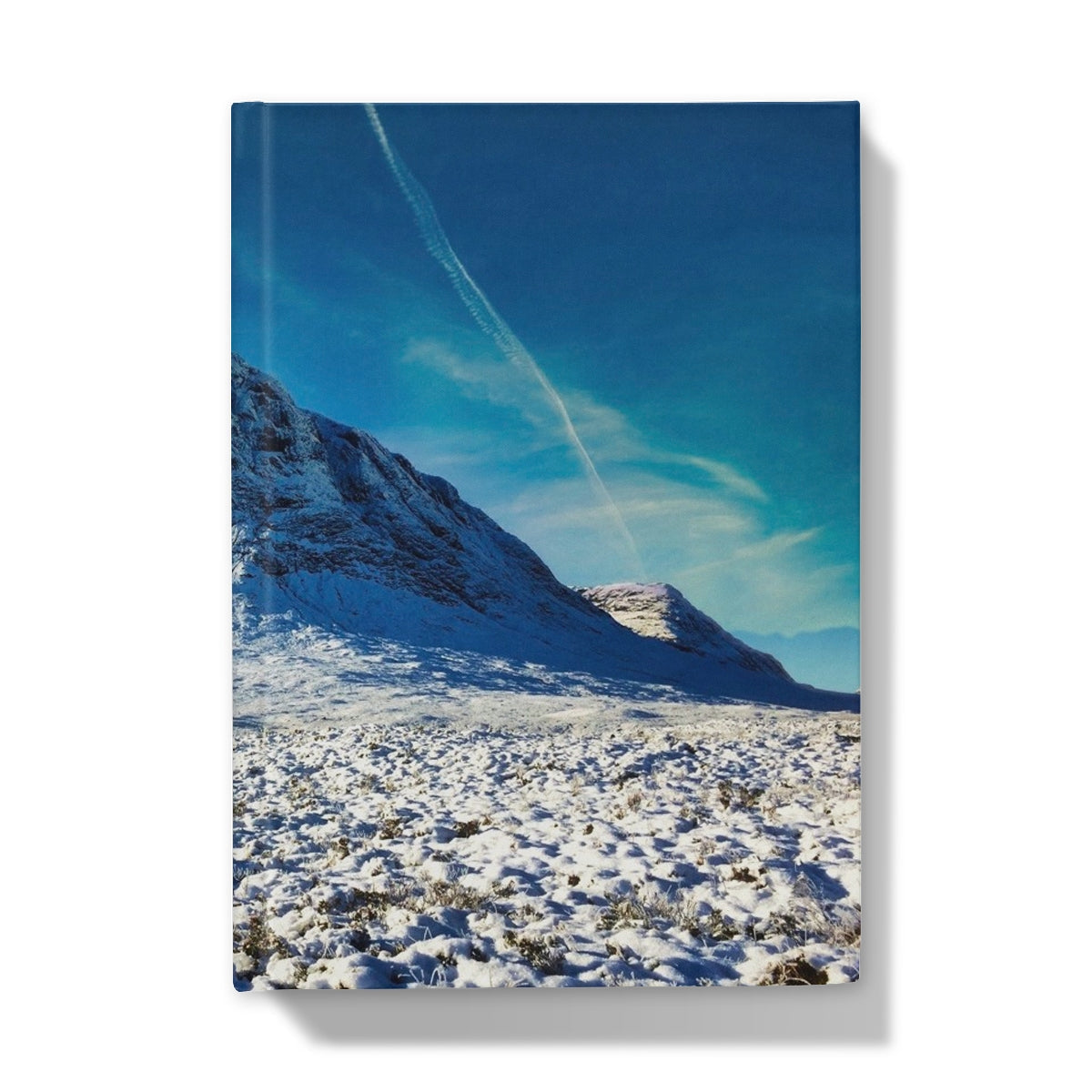 Snow-covered Buachaille Etive Mor mountain journal with blue sky