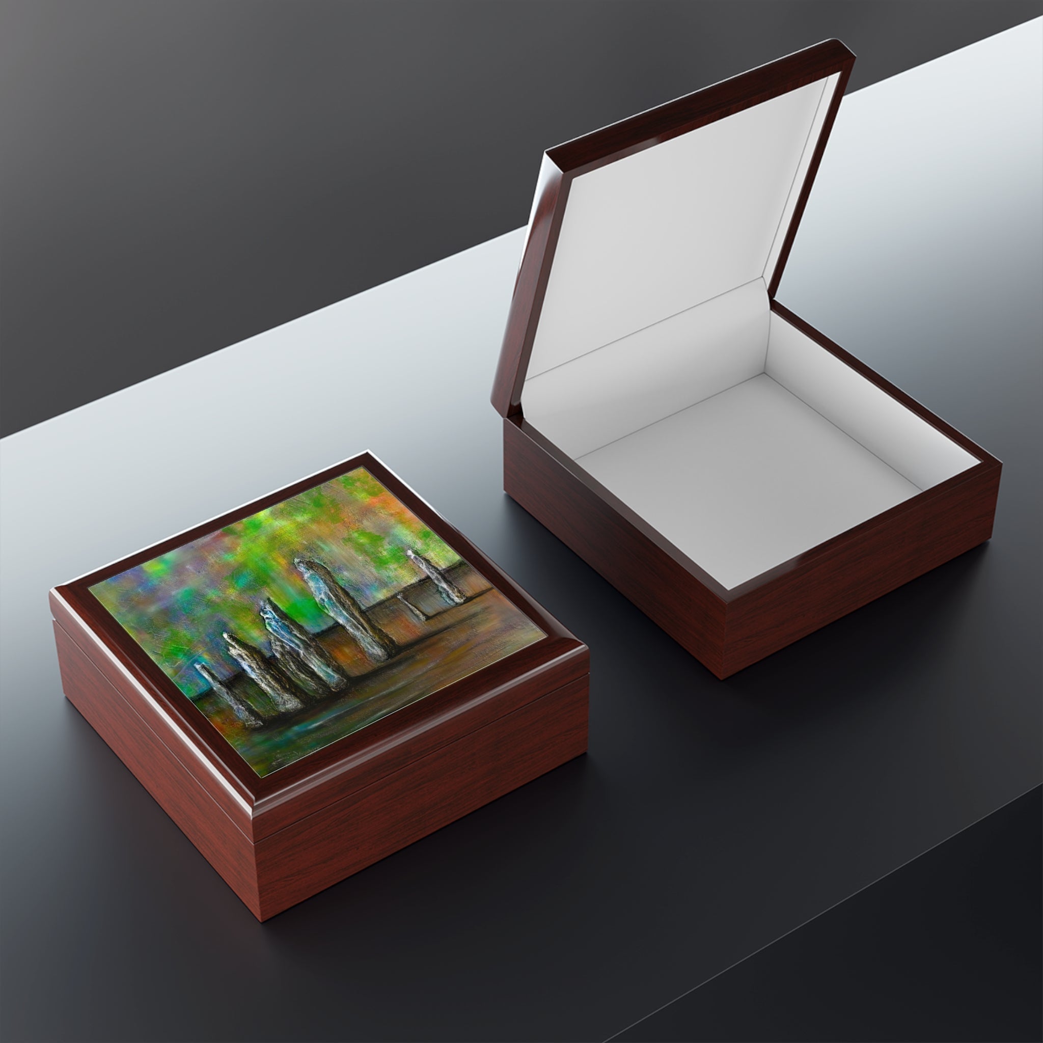 Two wooden Callanish Northern Lights art jewellery boxes with glossy finish, one open and one closed