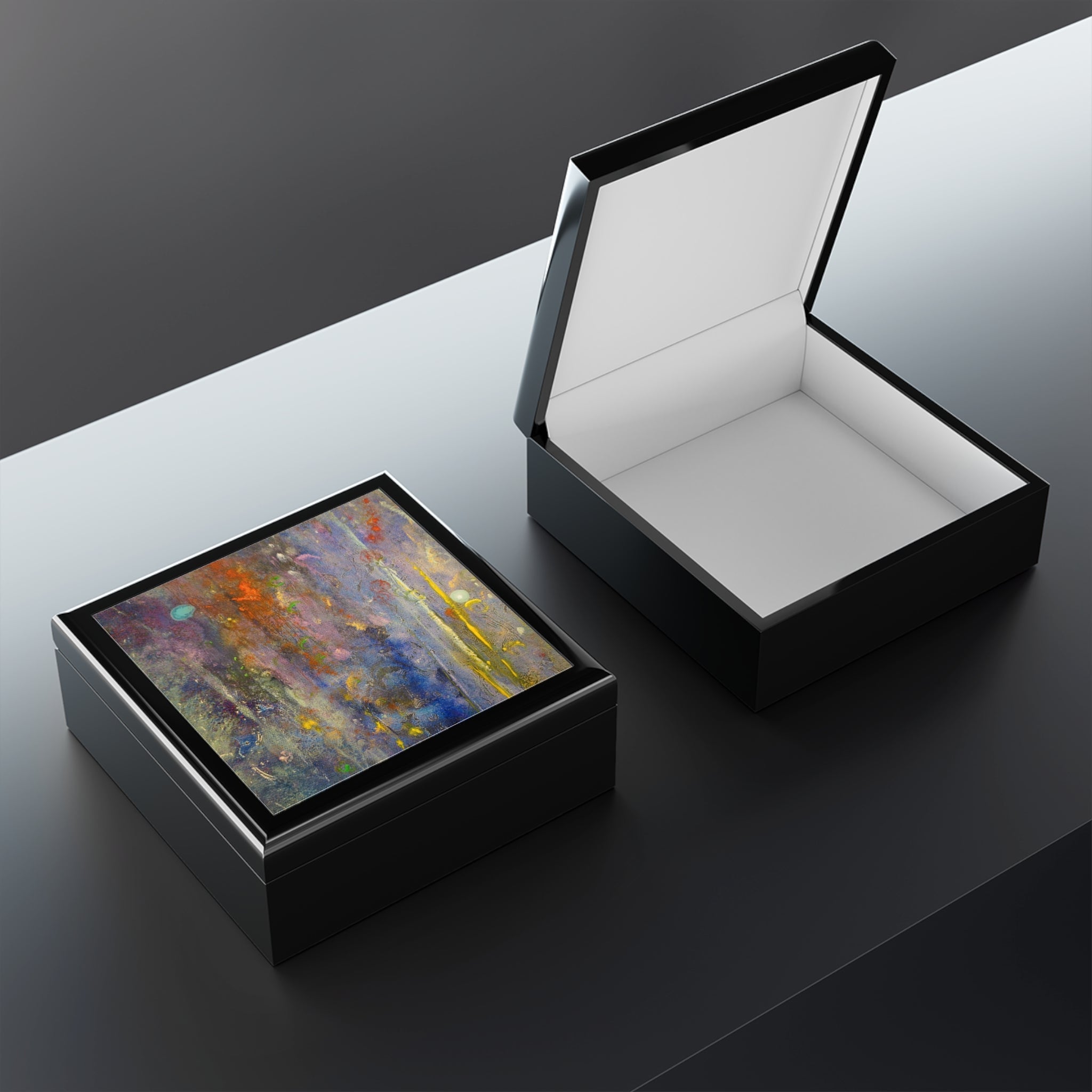 Black lacquered wooden jewelry boxes with abstract art lids from Caringorms Waterfall collection