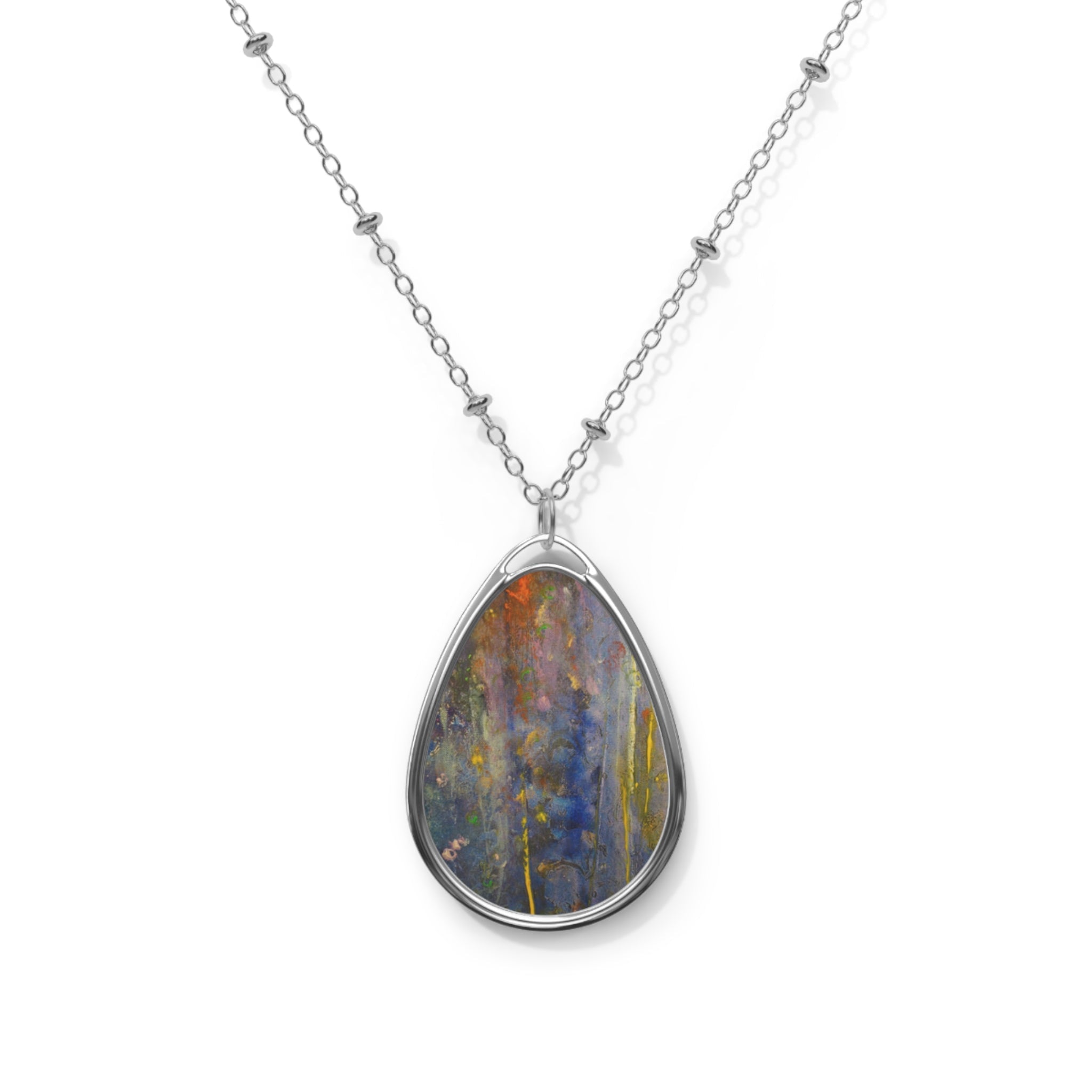 Silver chain necklace with teardrop-shaped pendant featuring abstract colorful Scottish art design