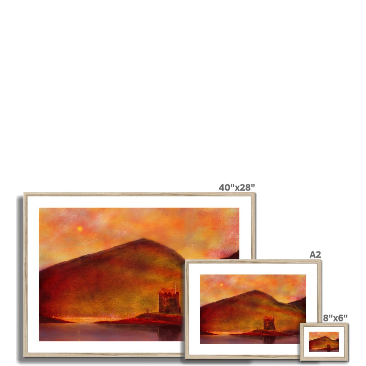 Three framed landscape prints of Castle Stalker Sunset displayed in varying sizes