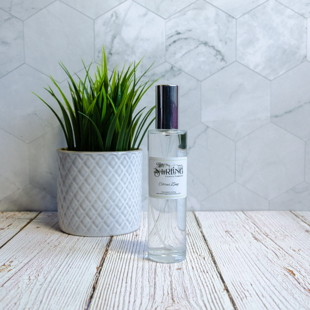 Clear glass Citrus Zing room spray bottle with silver cap and label