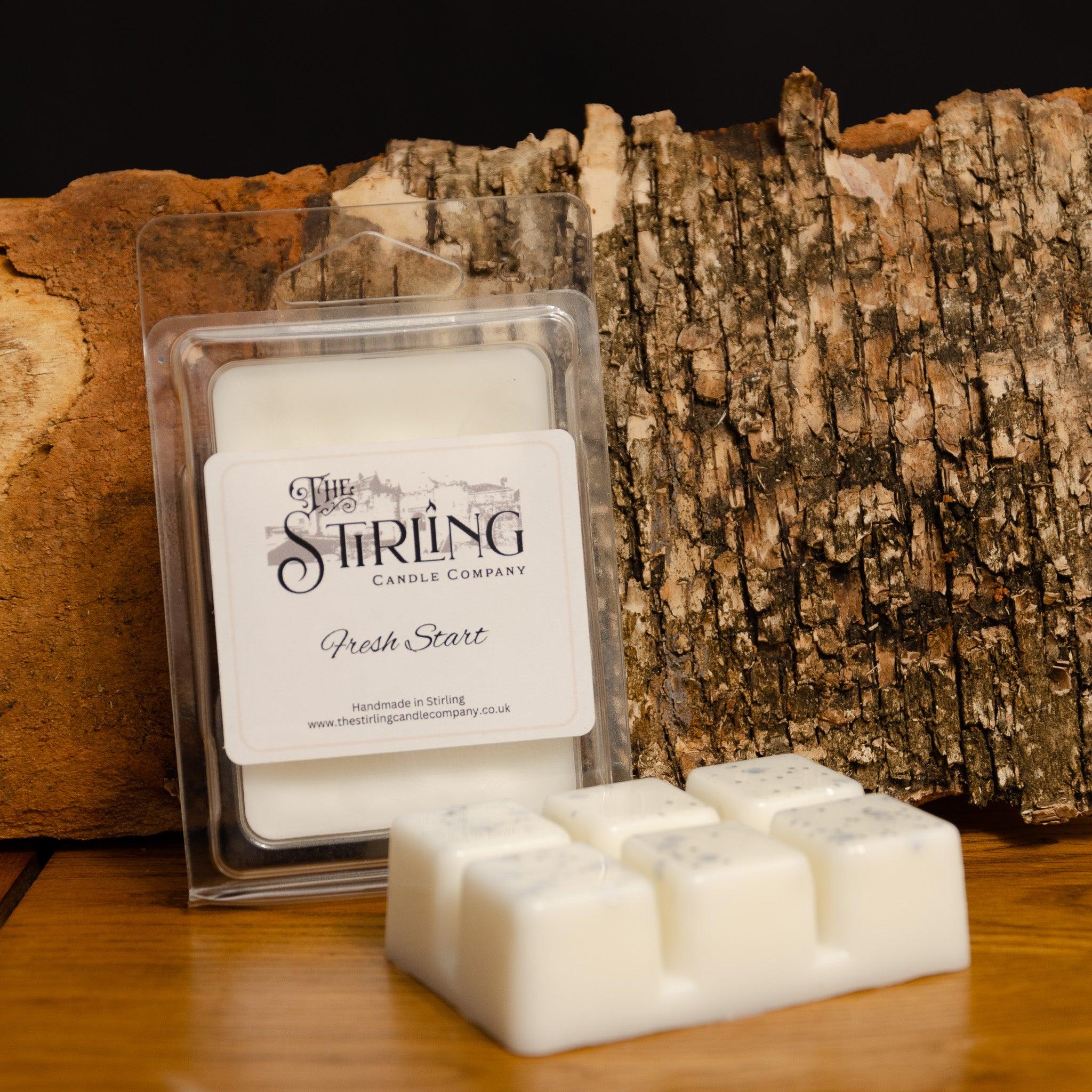 White fresh start wax melt clamshell from stirling candle company in clear plastic tray with branded label