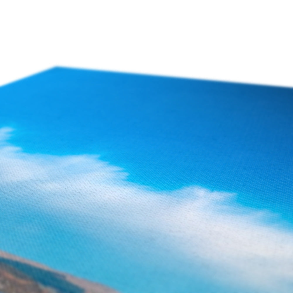 Blue sky with white clouds over Clogh Lighthouse canvas print