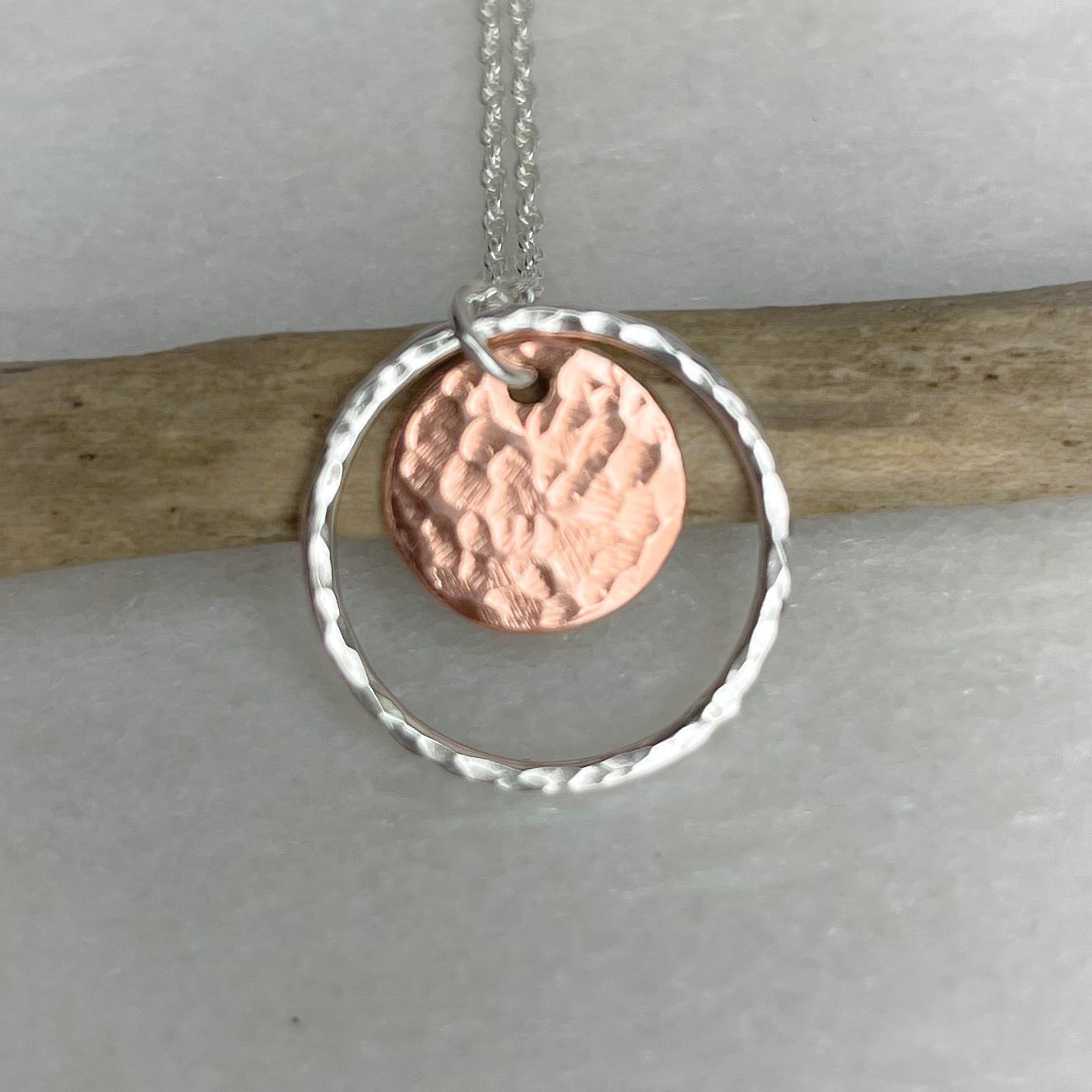Delicate hammered copper disc necklace in silver ring by Lindsay Mcdowall Jewellery