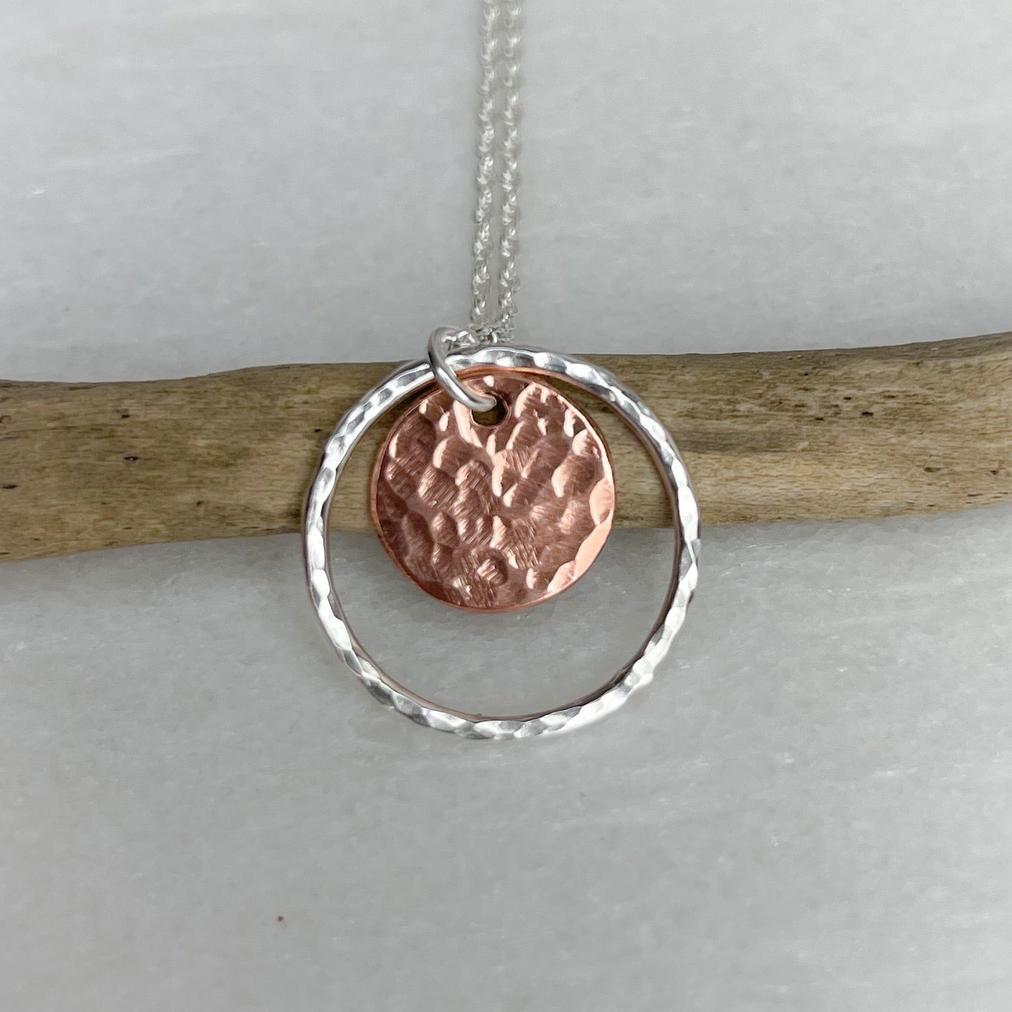 Copper disc necklace with hammered copper in silver hoop by Lindsay Mcdowall Jewellery