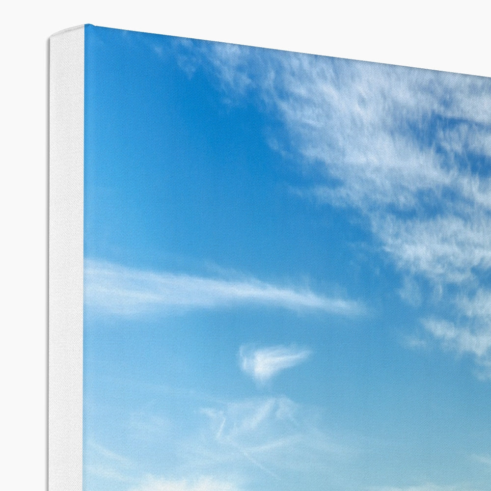 Cloud-shaped canvas wall art with white frame, blue sky and fluffy clouds design from Crocodile Rock Millport Photography Prints