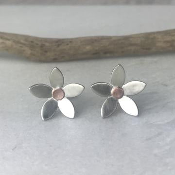 Silver daisy stud earrings with rose-gold center by Lindsay Mcdowall Jewellery