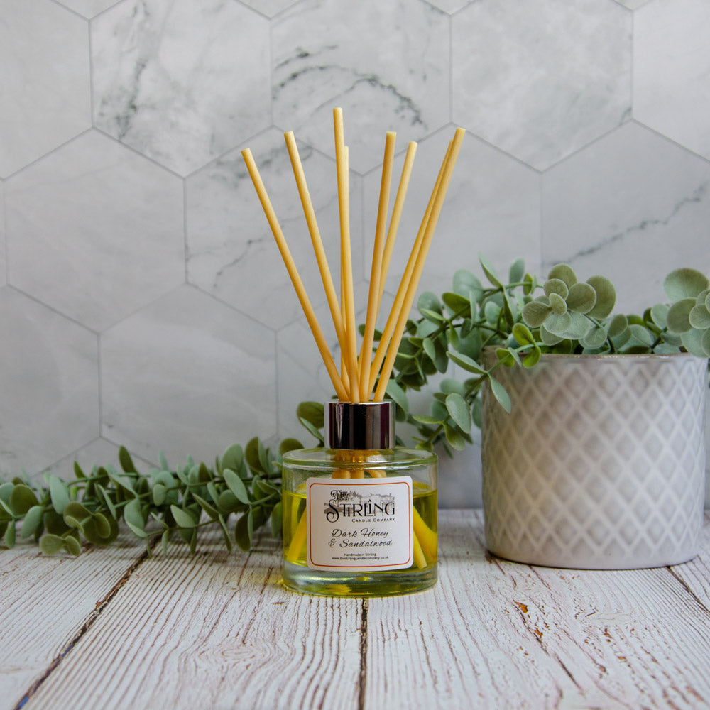 Dark Honey & Sandalwood 100ml diffuser with yellow liquid and golden reeds