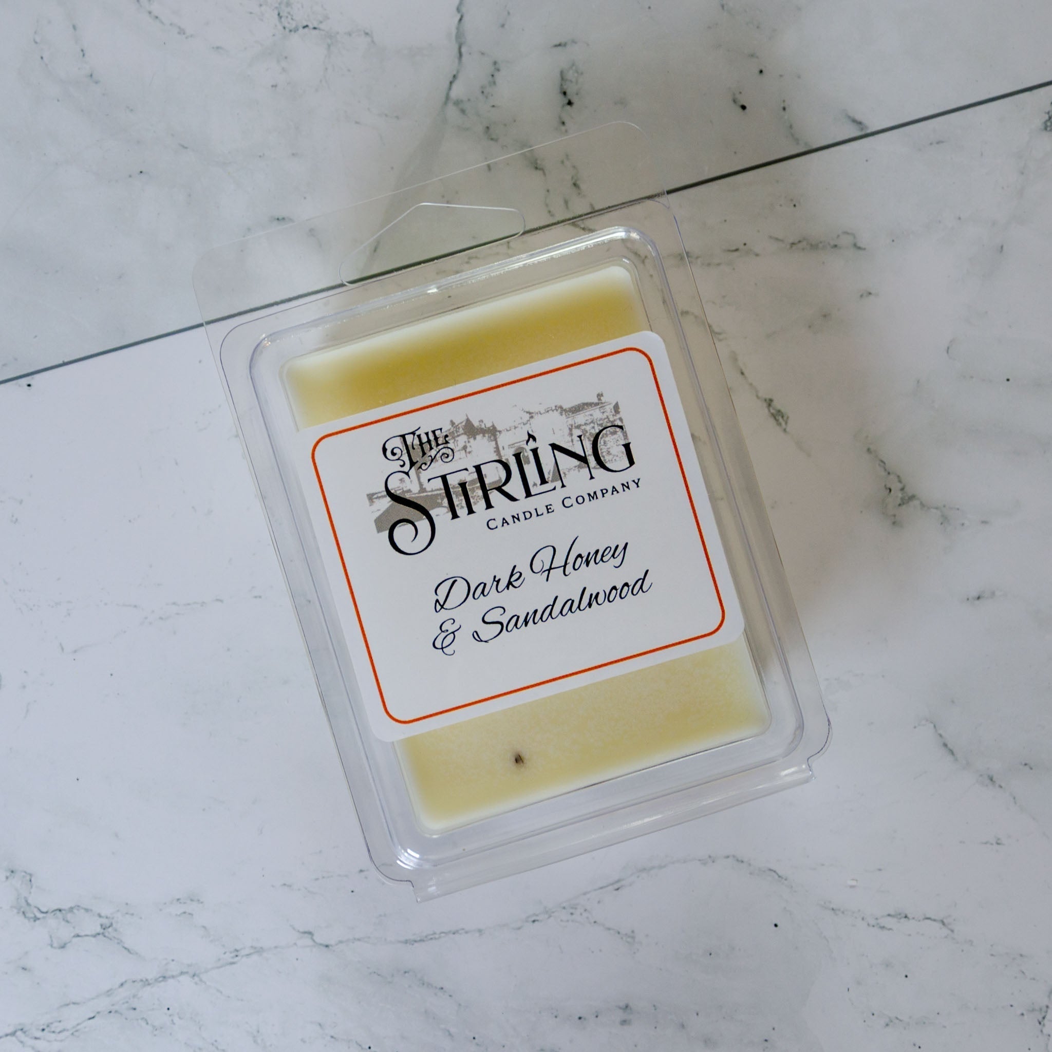 Dark Honey & Sandalwood wax melt clamshell from Stirling Candle Company