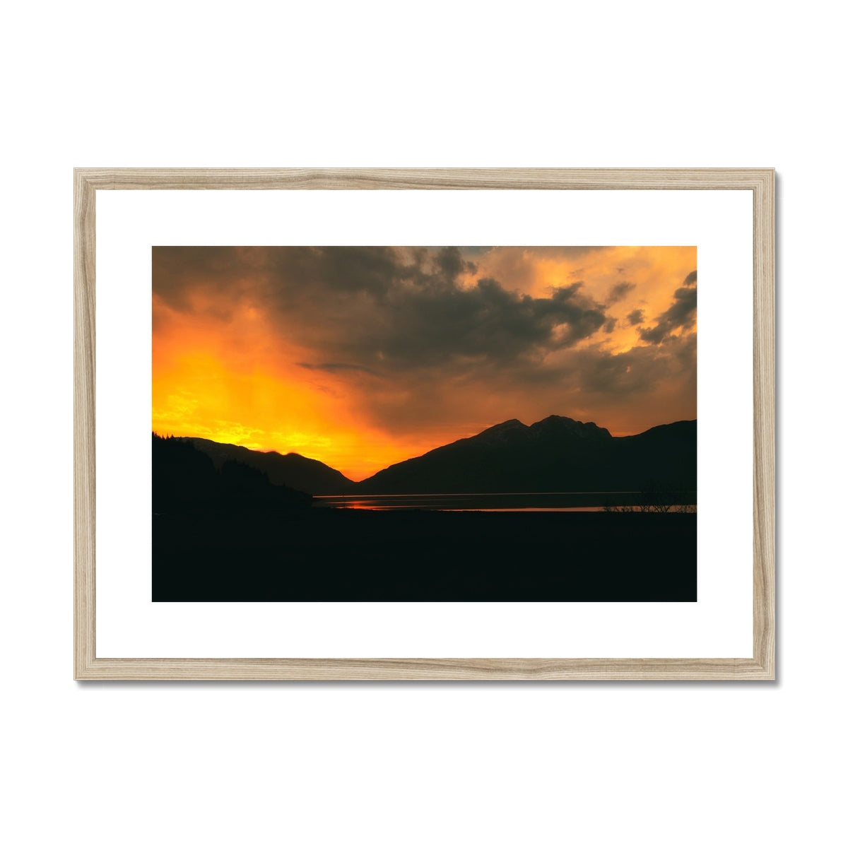 Deep Loch Leven sunset print in gold frame with vibrant orange hues and silhouetted mountains