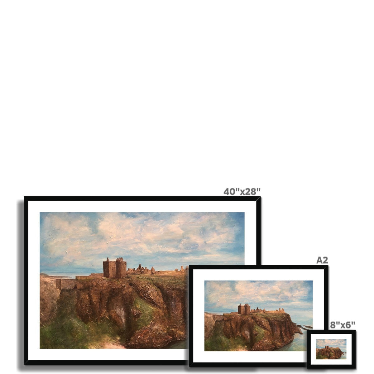 Framed landscape paintings of Dunnottar Castle on a cliff overlooking the sea