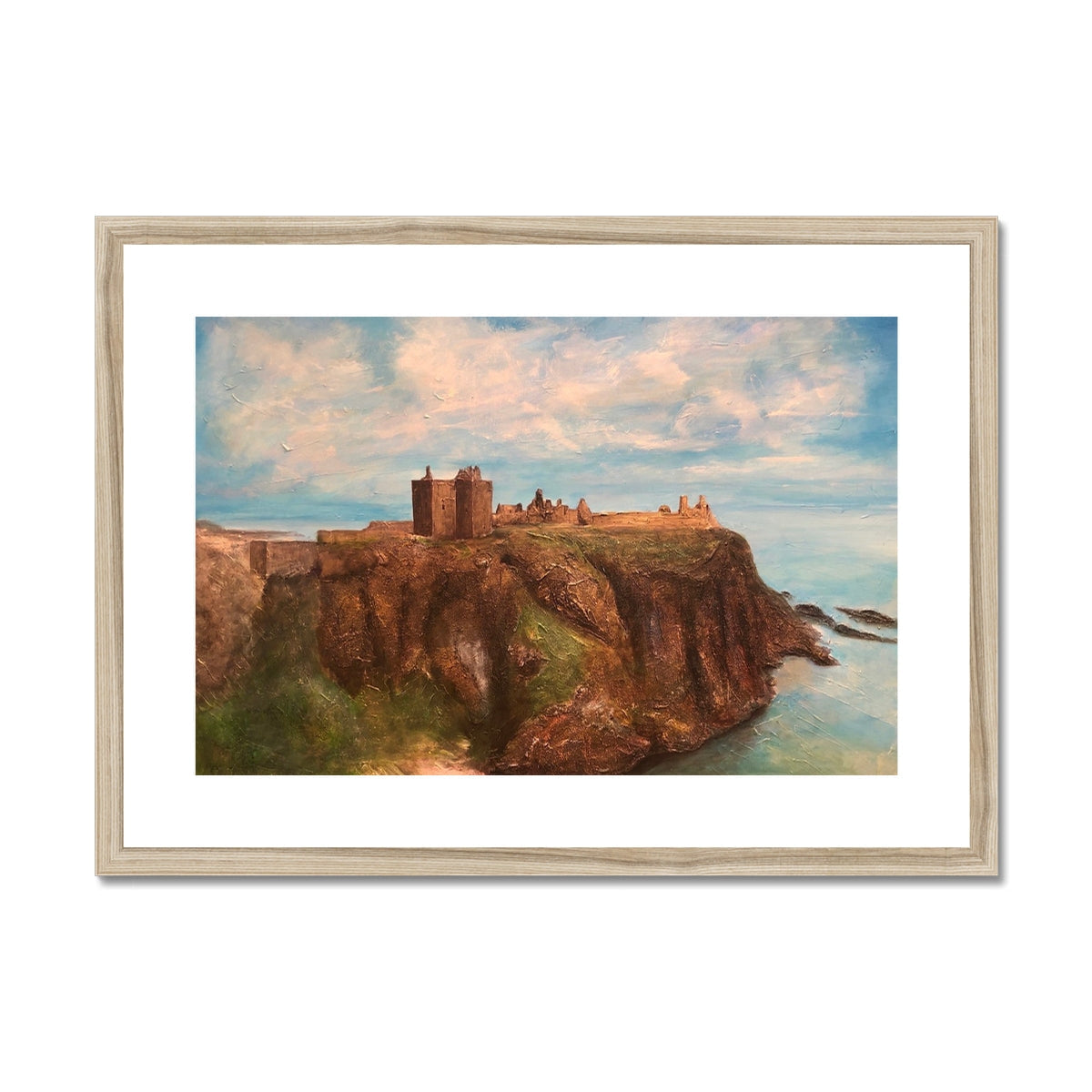 Framed oil painting of Dunnottar Castle on a cliff overlooking the sea