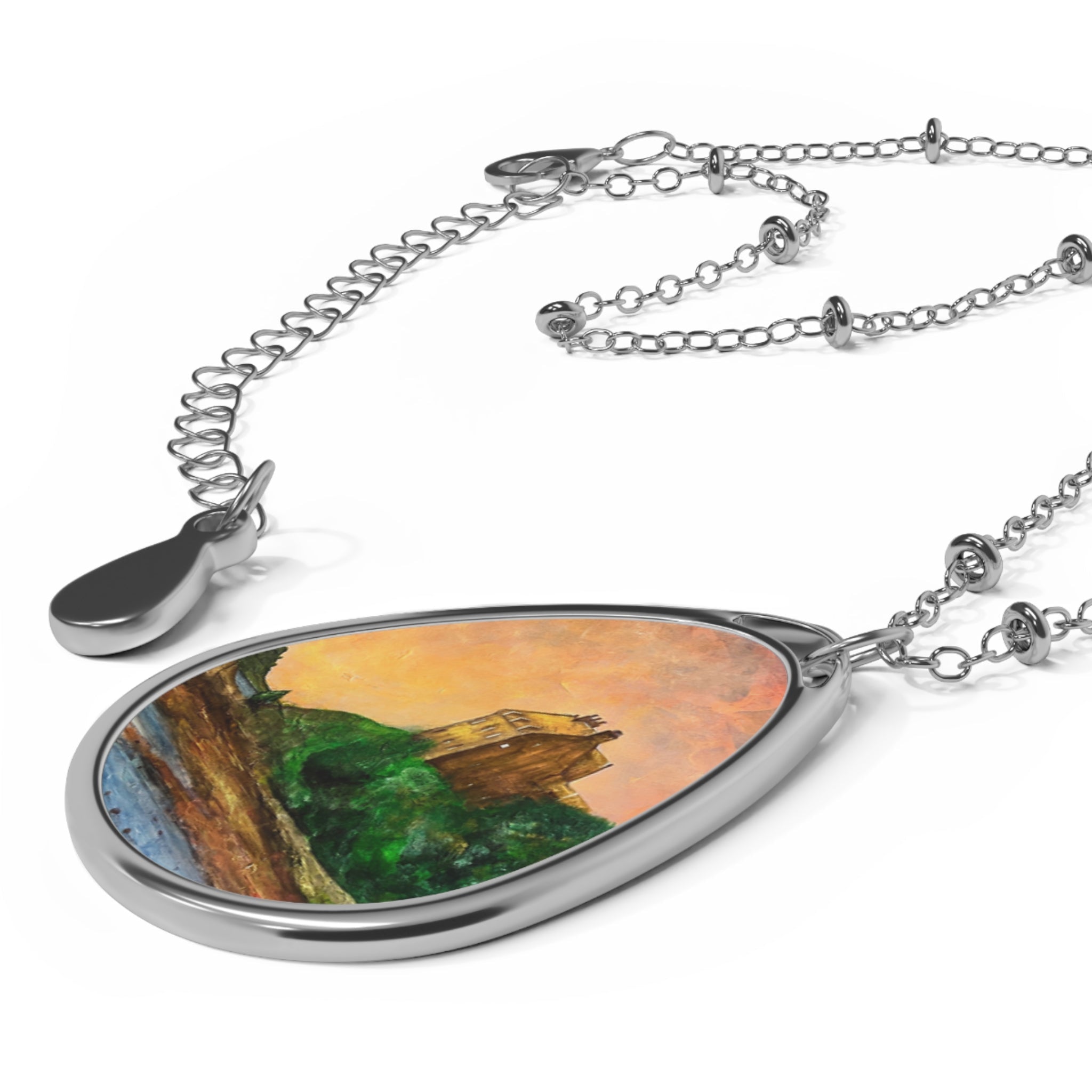 Silver-toned teardrop pendant necklace featuring a landscape painting inspired by Duntrune Castle Scotland