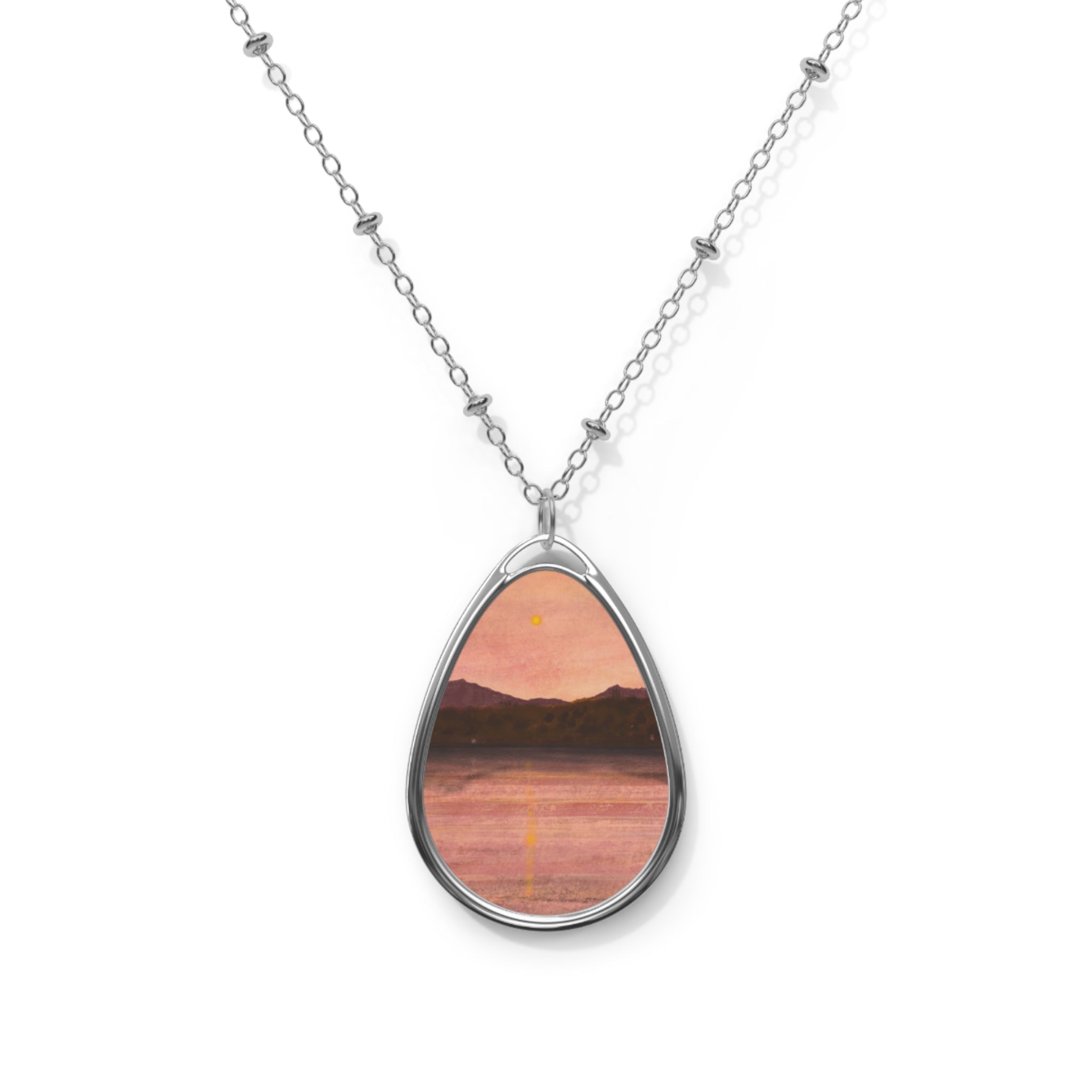 Silver teardrop pendant necklace with dusk sunset over Arran & Bute mountains