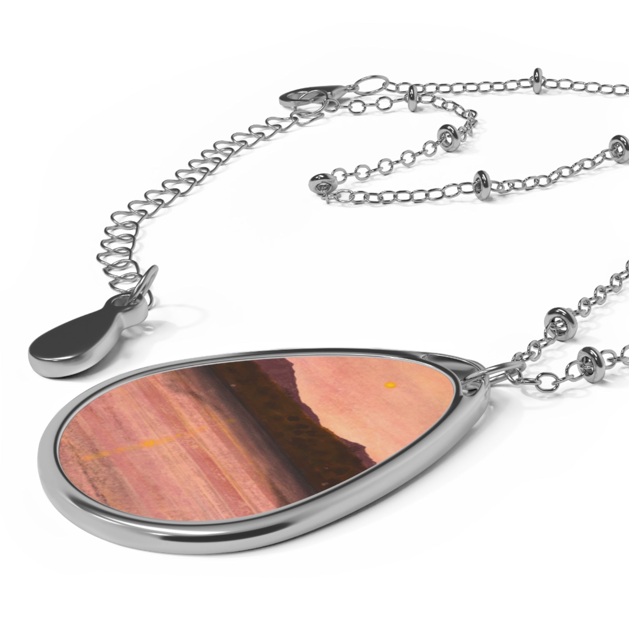 Silver teardrop pendant necklace with pink orange Arran & Bute canyon landscape