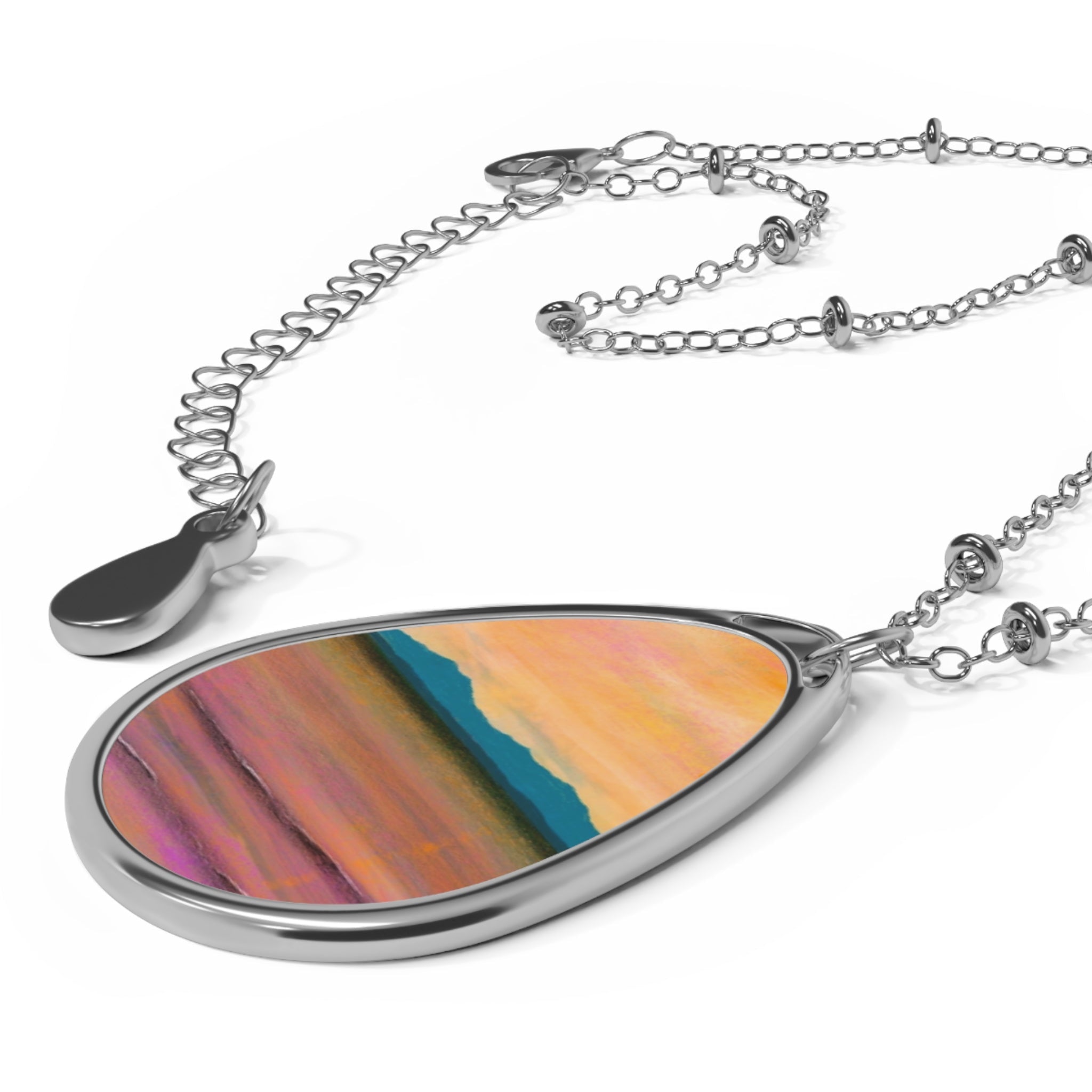 Silver teardrop pendant necklace with abstract landscape design from Dusk Over Arran collection