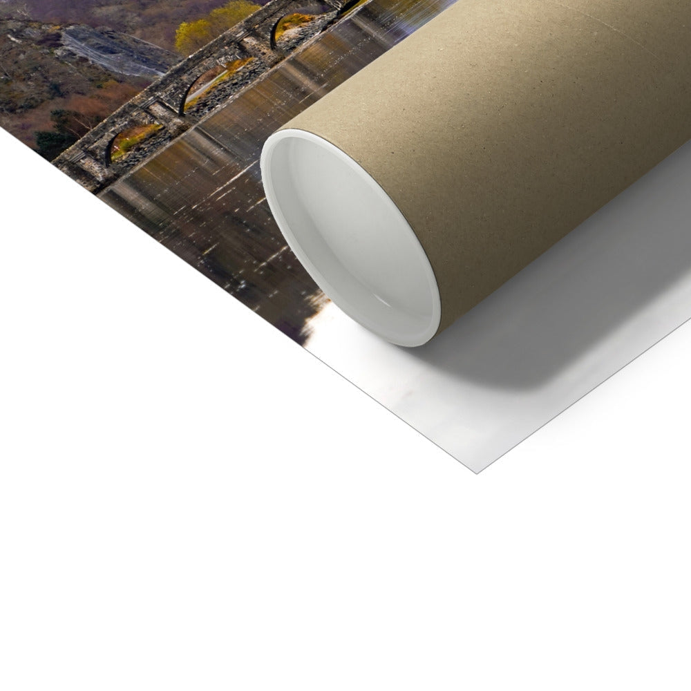 Rolled brown cardboard tube with Eilean Donan Castle art print
